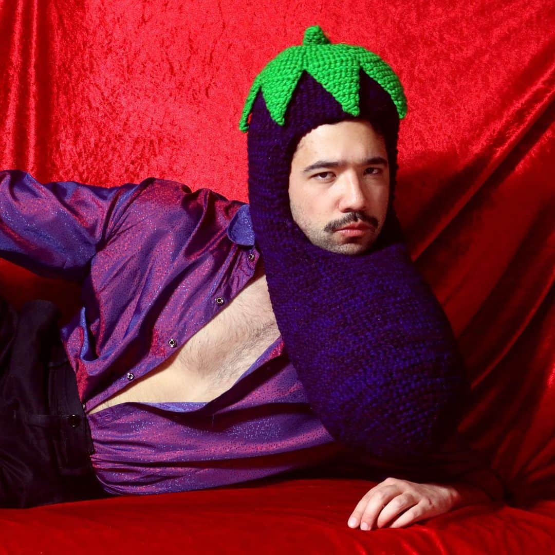 Phil Fergusonのインスタグラム：「When he asks for a sexy pic of the 🍆 ;)  #art #craft #eggplant #crochet #hat #sexy #sxc. #exy #purple #queerart #layingdown #lazy  (And because people ask where I’ve been buying all my new clothes on my stories, this shirt was one of the ones I got from @shagmelbourne the other day and just some op shop find @acnestudios pants lol)」