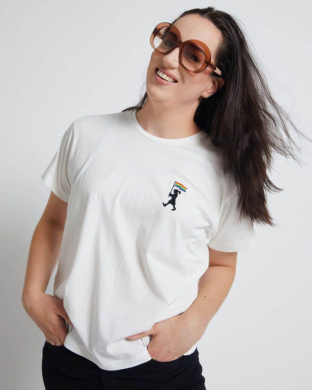 カレンウォーカーのインスタグラム：「It’s @AucklandPride month and the Runaway Girl marches in support of @RainbowYOUTH. NZ $10 from every Pride t-shirt and sweatshirt and $5 from every iPhone case sold* will be donated to the charity. ⁣ *This represents the entirety and more of any profit from these T-shirts so please be assured 100% of proceeds are going to RainbowYOUTH as an additional contribution from Karen Walker Ltd. ⁣ Photographed here is @MissGeenax, a transfeminine drag artist and non-binary musician from Tāmaki Makaurau. She’s a showgirl at the legendary Caluzzi Cabaret and a regular performer in nightclubs and queer events across Aotearoa, spreading positivity, love and self-acceptance via storytelling through drag and pop music. Be sure to follow her for updates from @AucklandPride and festivities beyond.」
