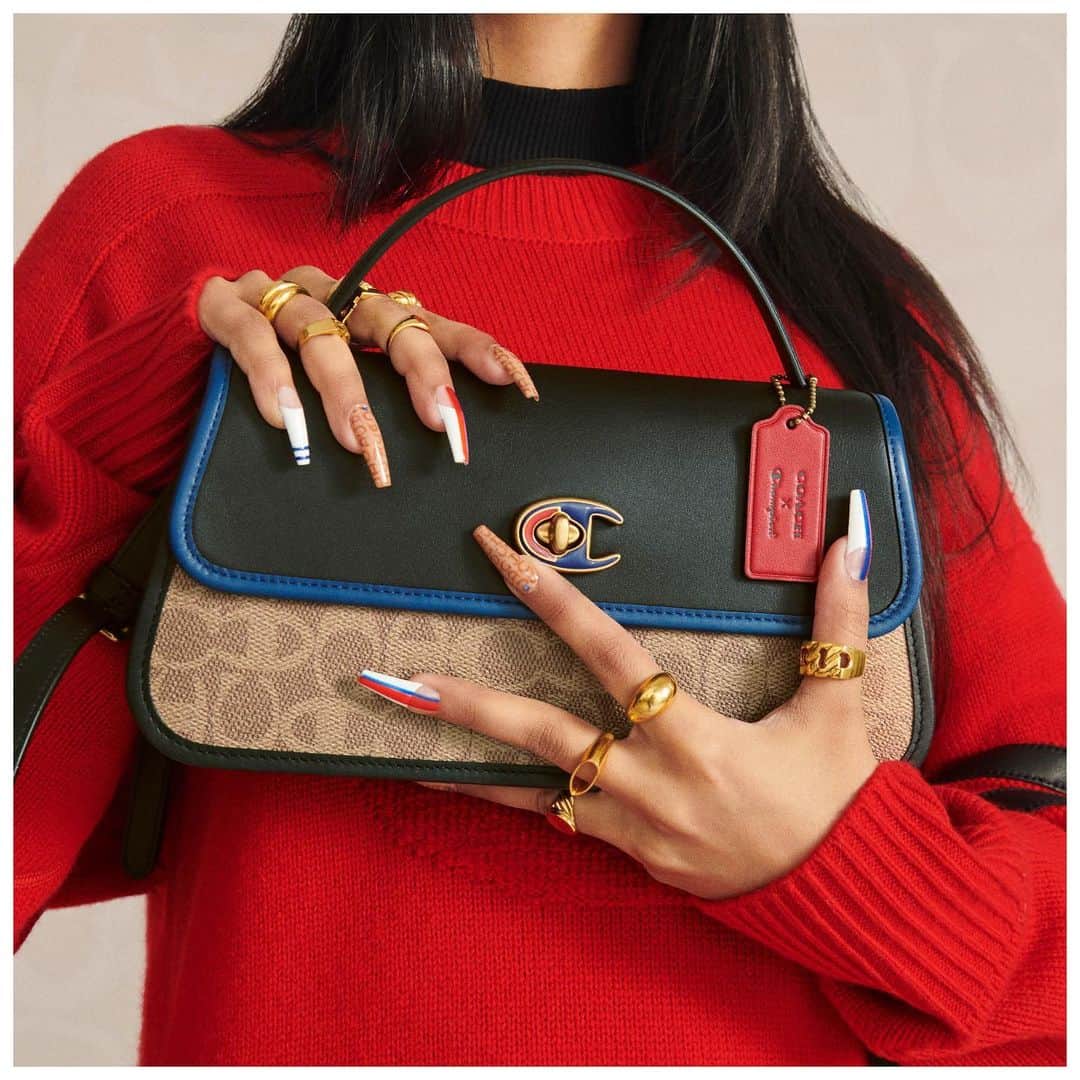 のインスタグラム：「This team works. Our #CoachxChampion clutch remixes codes from both houses: Coach's turnlock hardware and Signature pattern meet Champion's iconic C-logo and red-and-blue colorway. #CoachNY」