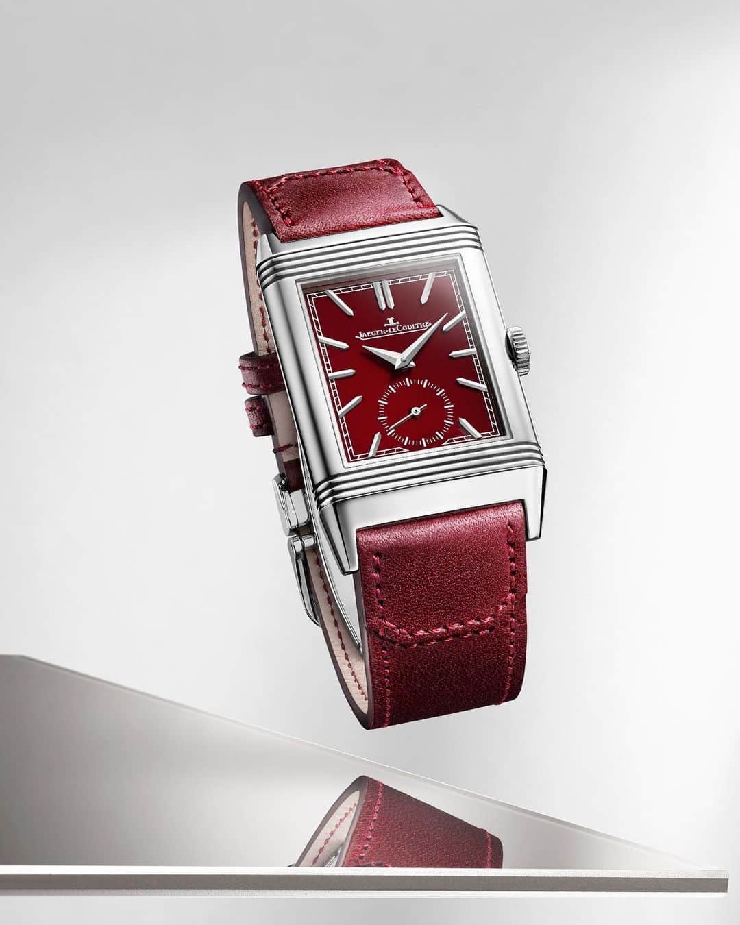 ジャガールクルトのインスタグラム：「Reverso, love in red.  #Reverso _ Reverso Tribute Small Seconds _ Alluring charm of the burgundy-red dial with a matching topstitched leather strap, designed by the world-famous Argentinian polo boots maker @casafagliano, created as neatly as the Maison's world-famous boots. Could it be the gift of a lifetime?  _ #JaegerLeCoultre #Reverso #JLCGift #ValentinesDay #Style #ArtDeco #Icon #HomeofFineWatchmaking #SwissWatch #ValleeDeJoux #Watchmaking #Craftsmanship #SavoirFaire」
