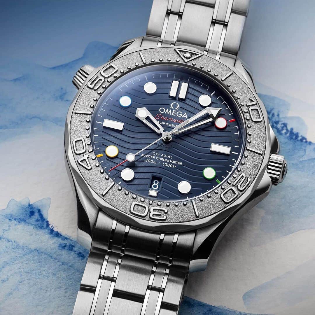 WATCHMANIAのインスタグラム：「@omega has been the Official Timekeeper of the Olympic Games since 1932. Beijing 2022 will be the 30th Olympics that Omega will have the role of Official Timekeeper. @omega has introduced Seamaster Diver 300M “Beijing 2022” Special Edition in order to initiate celebrations of this worldwide event. Details and pricing on the watchmanias.com , link in bio.  @omega , 1932’den beri Olimpiyat Oyunlarının Resmi Zaman Tutucusu olma rolünü üstleniyor. Pekin 2022, Omega’nın Resmi Zaman Tutucusu rolüne sahip olacağı 30. Olimpiyat olacak. @omega , bu dünya çapındaki etkinliğin kutlamalarını başlatmak için Seamaster Diver 300M “Beijing 2022” Special Edition’ı tanıttı. Detaylar sitede. Link bioda.」