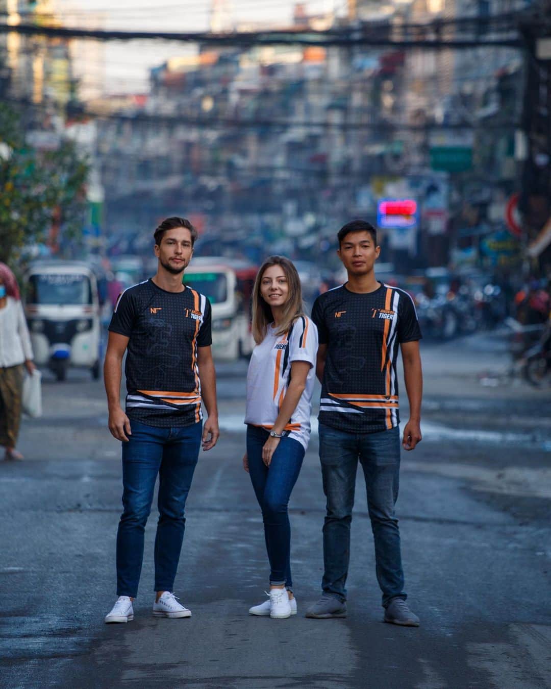 Shunsuke Miyatakeのインスタグラム：「Concept visual of @angkor_tiger  new jersey for 2021   Model / @unofficialmcberger  @mila.dance.wm  @holin_crystal  Place / St.107, near Orussey Market, Phnom Penh  Angkor Tiger FC, as a football club loved by Cambodian supporters, and as a football club that exists in people's daily life, I'm honored to be able to create their new concept visual not in a studio or in some privileged place but in the middle of Everyday Life in Cambodia.」