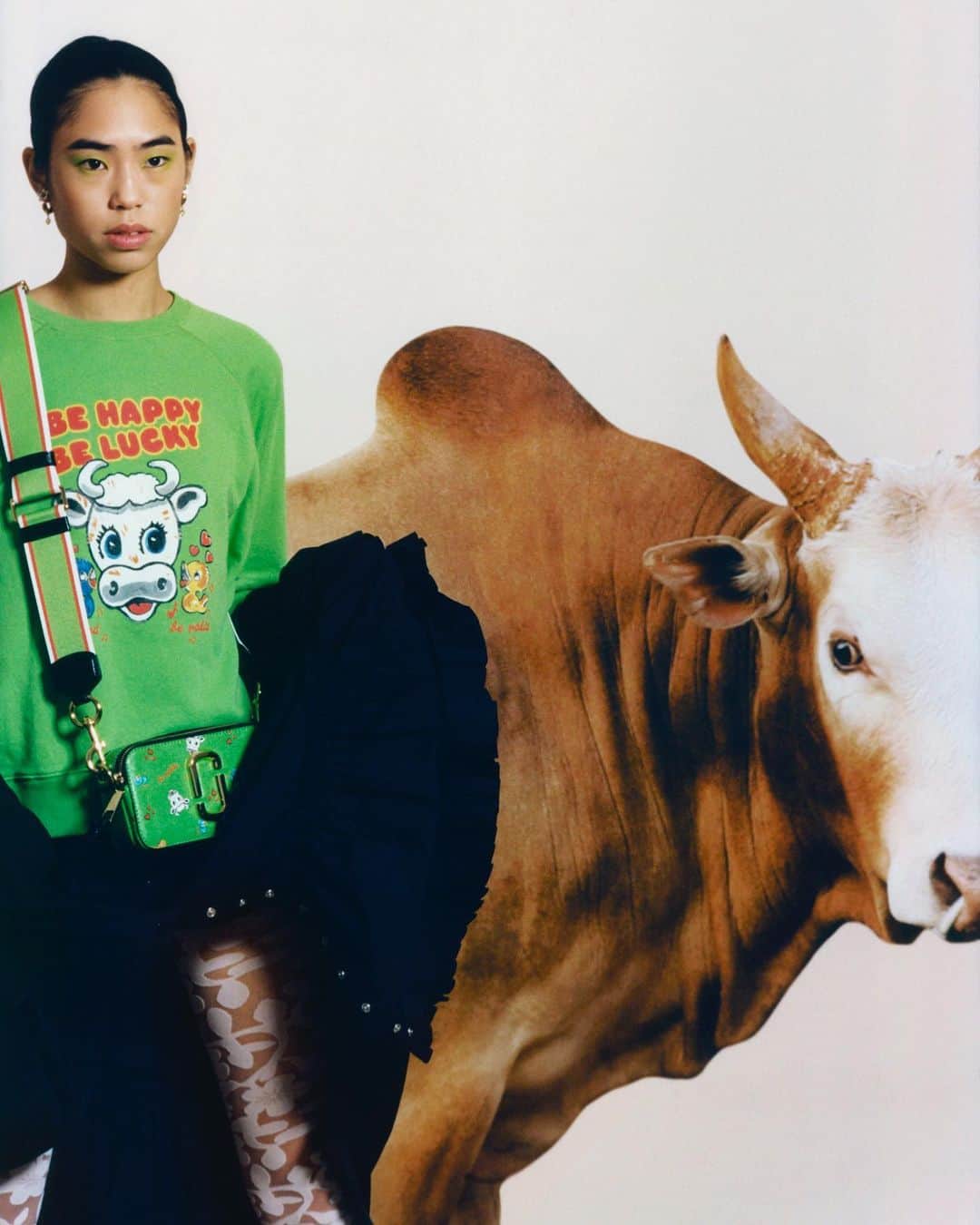 Marc Jacobsのインスタグラム：「In celebration of the Year of the Ox 🐂  Kristie wears THE SWEATSHIRT and THE SNAPSHOT from our Lunar New Year collaboration with artist Magda Archer.  Photographed by @JoyceSzeNg Styled by @EmersonDanielle​  December 8, 2020 in London, England.」