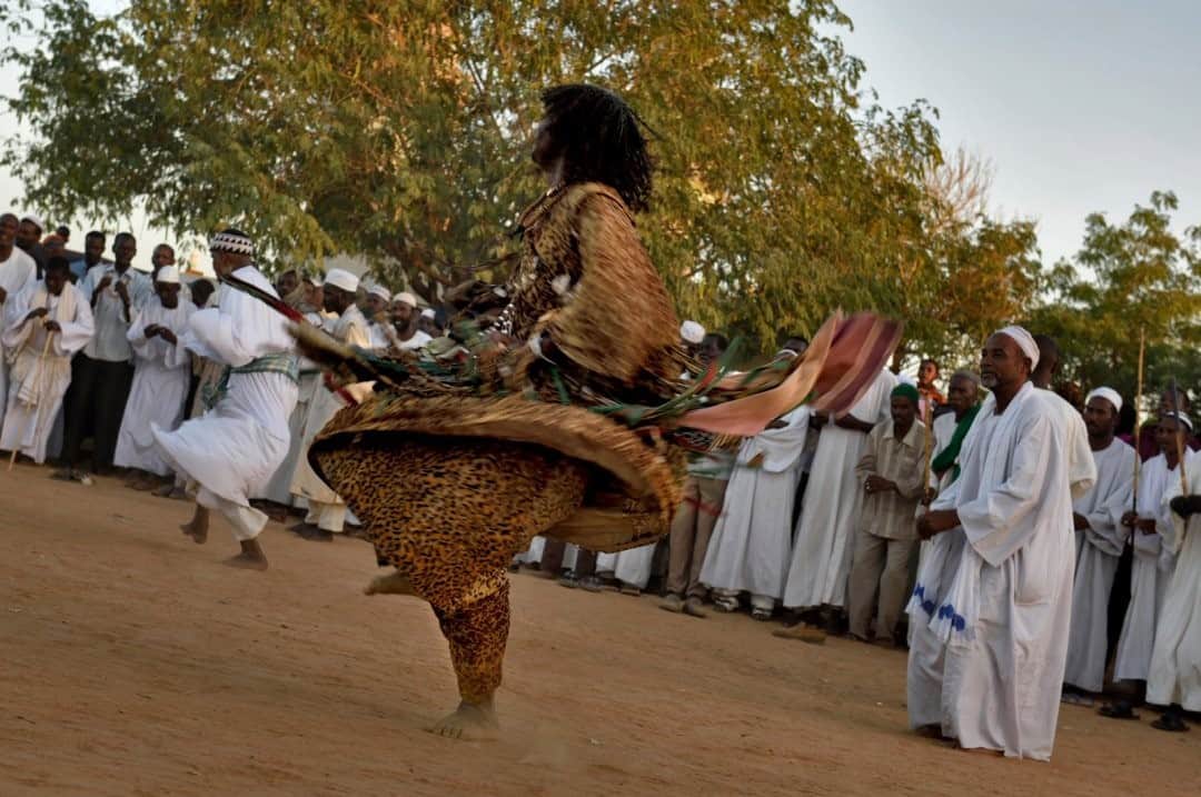 National Geographic Travelさんのインスタグラム写真 - (National Geographic TravelInstagram)「Photo by Robbie Shone @shonephoto / A ceremony of the whirling dervishes takes place around sunset next to the tomb of Ahmed al Nil (Hamad el Nil mosque), Sudan. These dervishes, followers of the Qadiriyya, dress in brightly colored tunics, dance and swirl themselves in prayer in an ecstatic state, and then turn to the east and pray.」2月5日 2時33分 - natgeotravel
