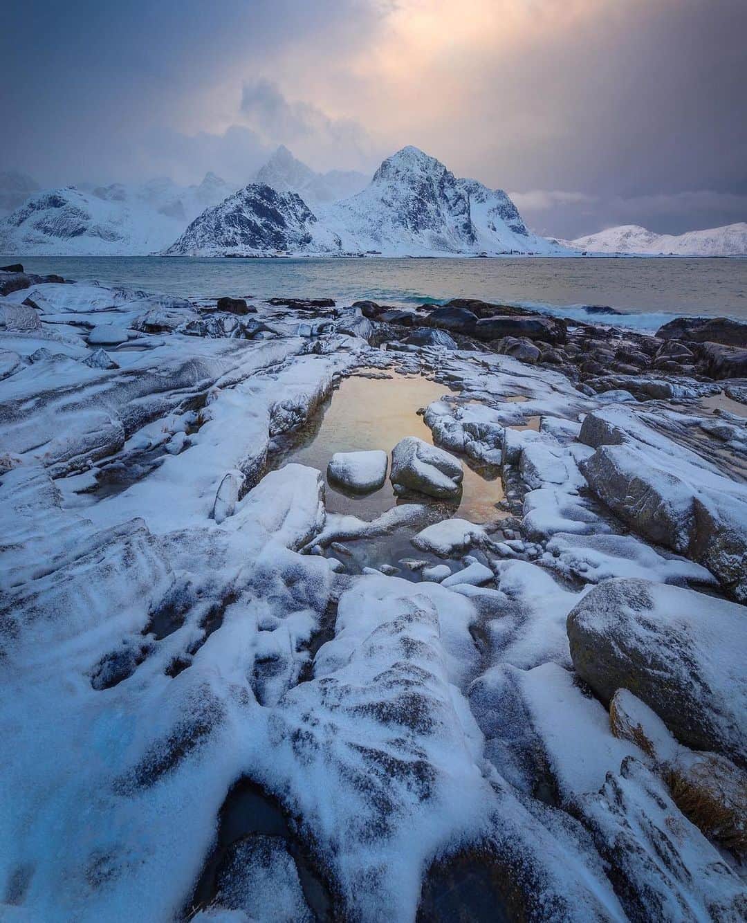のインスタグラム：「@philipesterle One of the things I really loved about photographing the coasts in the Lofoten Islands was that I could shoot the same scene over and over, but with different foregrounds each time just by moving a few feet in any direction.⁠⠀ ⁠⠀ I'm sure other rocky coasts share this. But I guess I haven't visited enough rocky coasts.⁠⠀ ⁠⠀ Any suggestions for others? :) ⁠⠀ ------------⁠⠀ v a r e i d s u n d e t 12276⁠⠀ ⁠⠀ The rocky shoreline along Vareidsundet, leading into Flakstadpollen.⁠⠀ ⁠⠀ Vareid, Nordland, Norway⁠⠀」