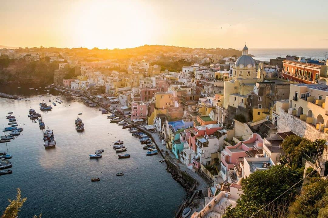 National Geographic Travelさんのインスタグラム写真 - (National Geographic TravelInstagram)「Photos by @francescolastrucci / The tiny island of Procida, Italy, was recently declared the Italian Capital of Culture 2022. It's the first time for an island, thanks to its timeless charm and an attractive cultural project that aspires to make the island a model of sustainable development. Procida is located in the Gulf of Naples. Its old port of Corricella, dominated by the Sanctuary of Santa Maria delle Grazie, remains the icon of the island. The boats, the fishermen’s nets, and the vibrantly colored houses that are reflected on the sea have been the set of numerous films such as the Italian classic “Il Postino” and “The Talented Mr. Ripley.”  Follow me @francescolastrucci for more places, daily life, and stories around the world. #procida #italy #history #landscapephotography」2月6日 0時49分 - natgeotravel