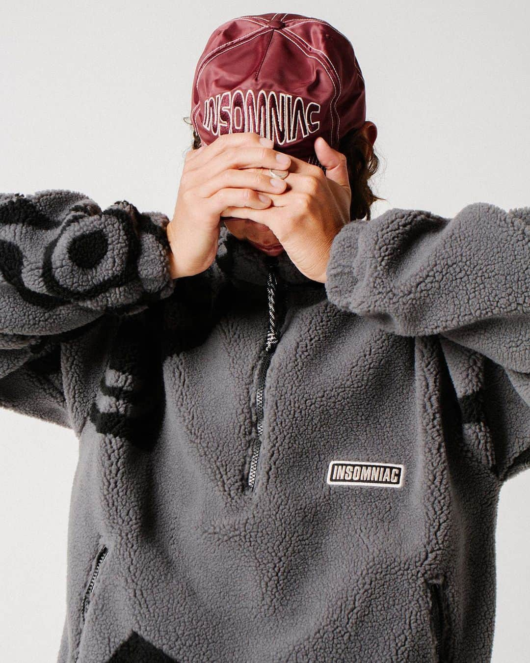 サキャスティックのインスタグラム：「@insomniacltd Pre Spring   Vertigo Pullover Charcoal Heavyweight jacquard knit sherpa, nylon lining, half zip entry, custom zipper pulls. Made in the USA.  Naysayer Hat Wine Nylon 5 panel snapback , unstructured, contrast stitching, direct embroidery. Made in the USA.」