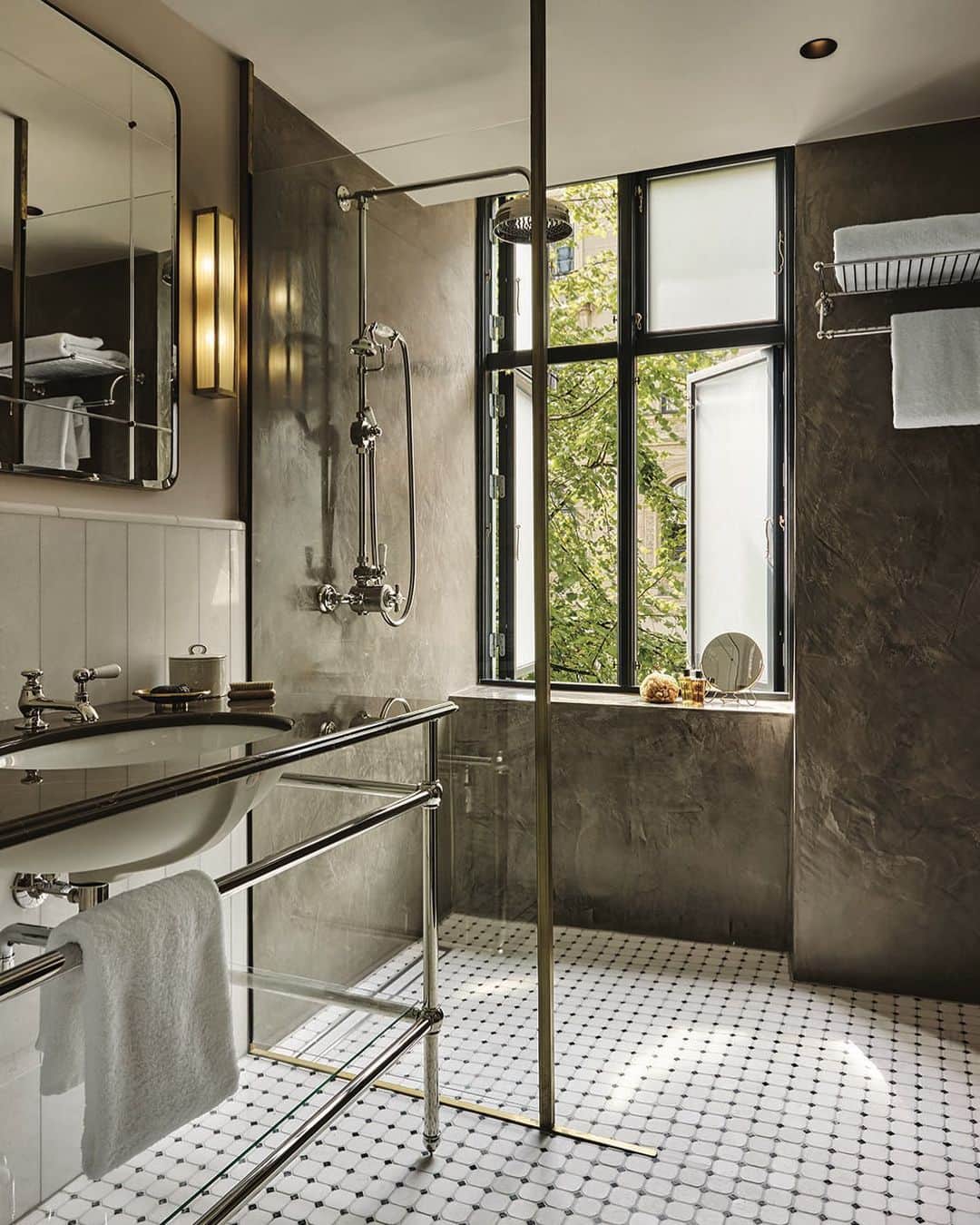 Homepolishのインスタグラム：「Take your cues from Copenhagen’s @hotelsanders and extend floors from the sink to the shower for a more open and fluid finish. Designed by @pernille_lind_studio_, architecture by @lind_almond.  Check out the link in bio for more design inspo and pro tips.」