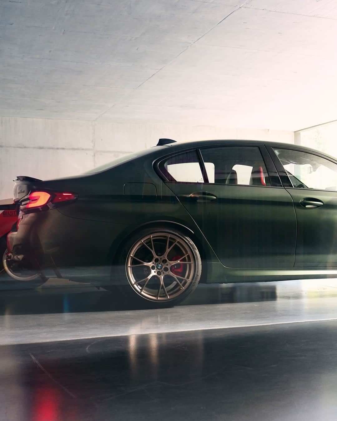BMWのインスタグラム：「Undeniable presence.  The first-ever BMW M5 CS.  #TheM5 #BMW #M5 #BWMM @bmwm __ BMW M5 CS: Fuel consumption weighted combined in l/100km: 11.3–11.1 (NEDC); 11.3–10.9 (WLTP), CO2 emissions weighted combined in g/km: 258–253 (NEDC); 257–248 (WLTP). Further information: www.bmw.com/disclaimer.」