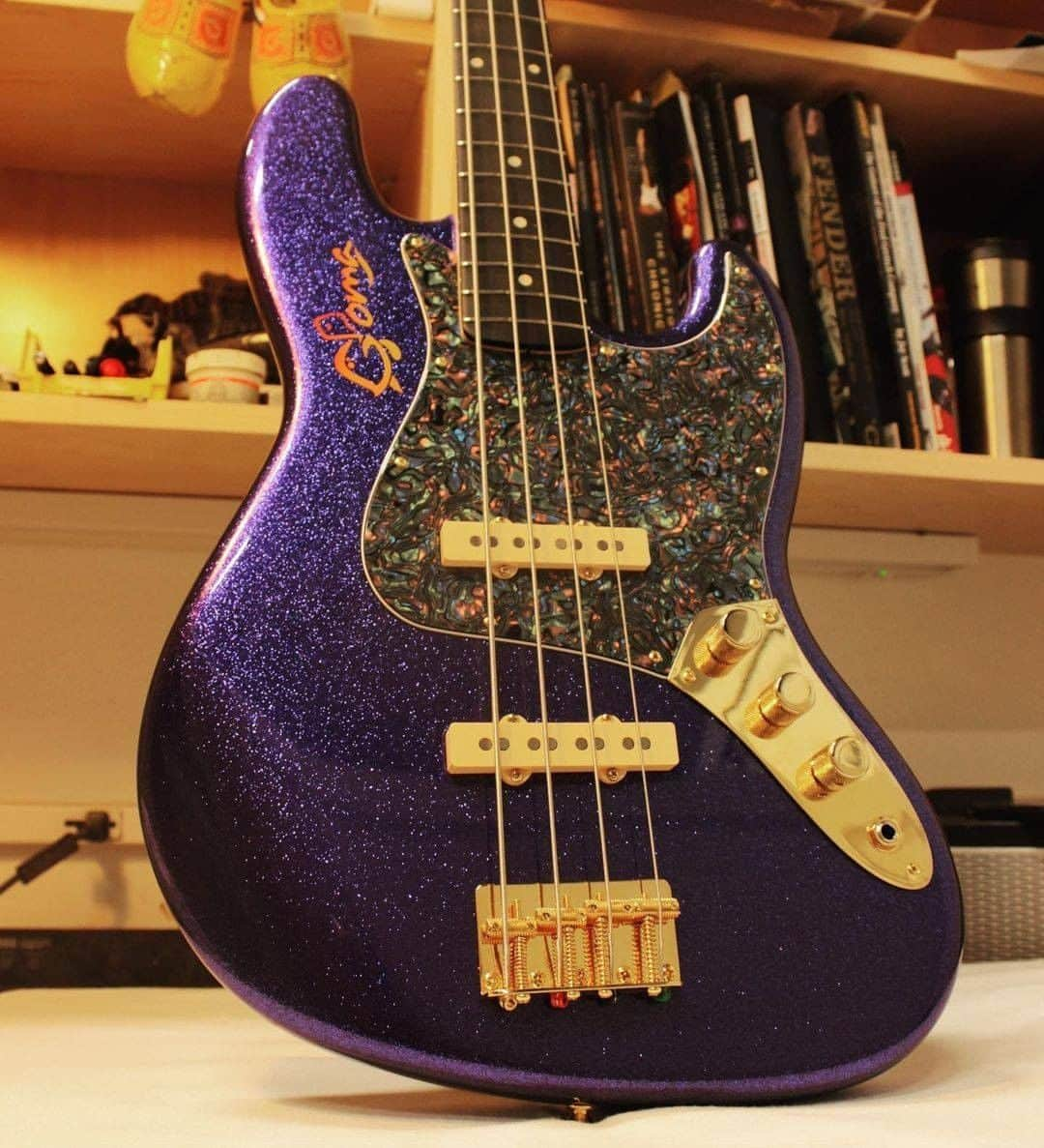 Fender Guitarさんのインスタグラム写真 - (Fender GuitarInstagram)「Master Builder @vincevantrigt_fender built an out-of-this-world '64 Jazz Bass for Chris Goma (@9goma).   Specs include: Purple sparkle with matching headstock, gold hardware with precision bass knobs and cream pickup covers, Josefina Campos hand-wound '60s Jazz Bass pickups, abalone celluloid pickguard, and signature logo airbrushed on the body in sunset burst. Swipe through for a closer look!」2月7日 2時00分 - fender