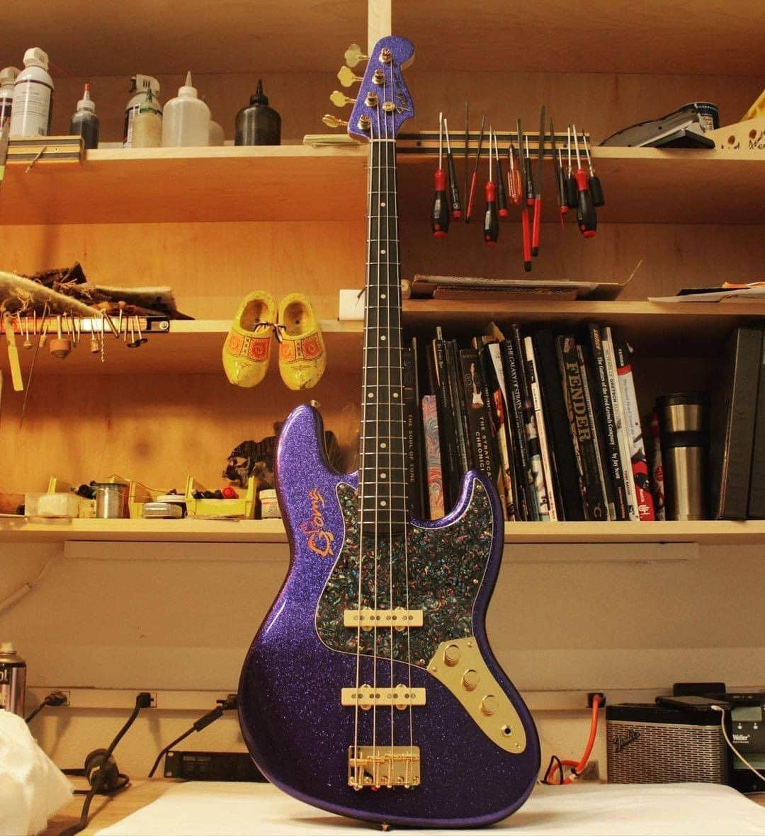 Fender Guitarさんのインスタグラム写真 - (Fender GuitarInstagram)「Master Builder @vincevantrigt_fender built an out-of-this-world '64 Jazz Bass for Chris Goma (@9goma).   Specs include: Purple sparkle with matching headstock, gold hardware with precision bass knobs and cream pickup covers, Josefina Campos hand-wound '60s Jazz Bass pickups, abalone celluloid pickguard, and signature logo airbrushed on the body in sunset burst. Swipe through for a closer look!」2月7日 2時00分 - fender