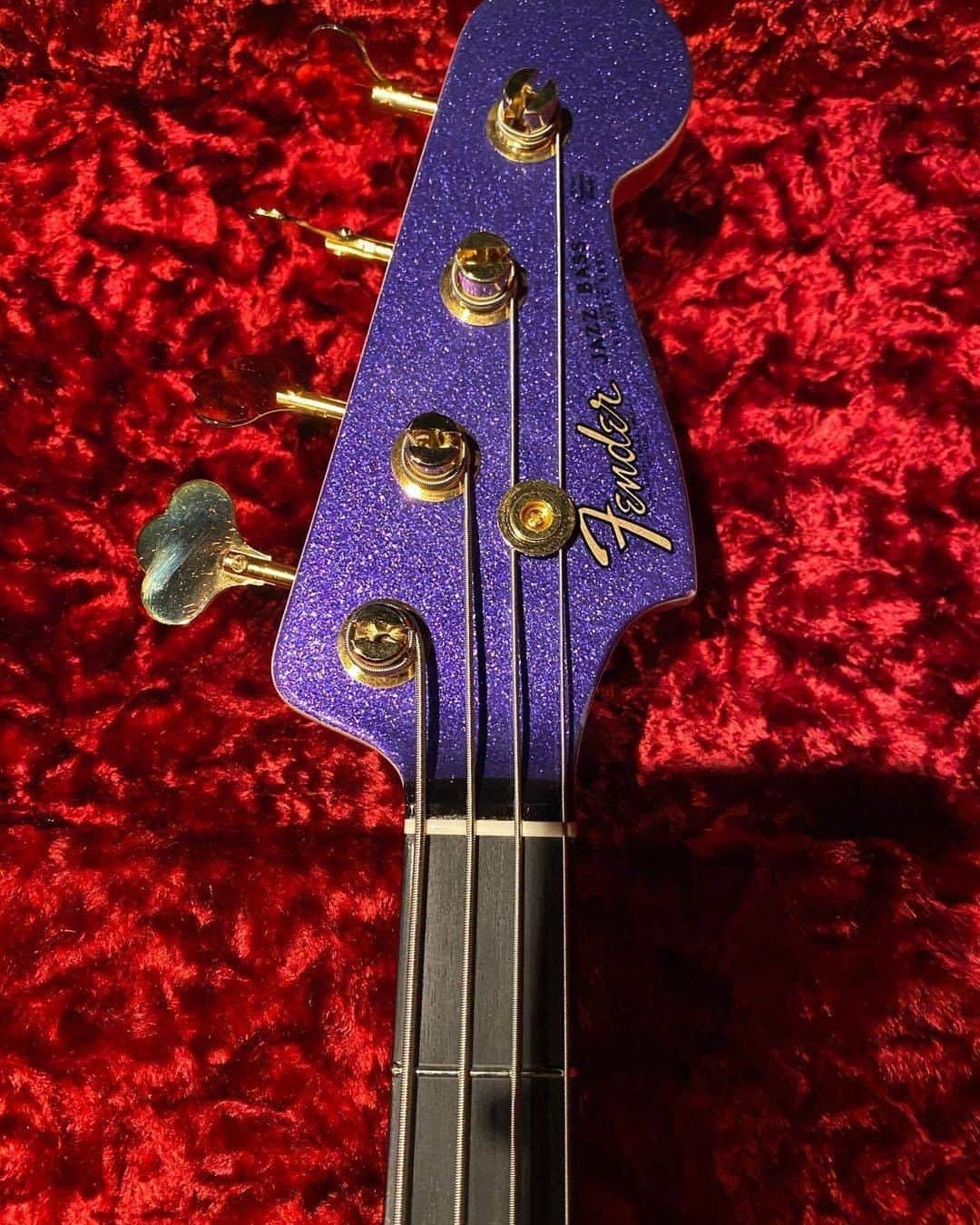 Fender Guitarさんのインスタグラム写真 - (Fender GuitarInstagram)「Master Builder @vincevantrigt_fender built an out-of-this-world '64 Jazz Bass for Chris Goma (@9goma).   Specs include: Purple sparkle with matching headstock, gold hardware with precision bass knobs and cream pickup covers, Josefina Campos hand-wound '60s Jazz Bass pickups, abalone celluloid pickguard, and signature logo airbrushed on the body in sunset burst. Swipe through for a closer look!」2月7日 2時00分 - fender