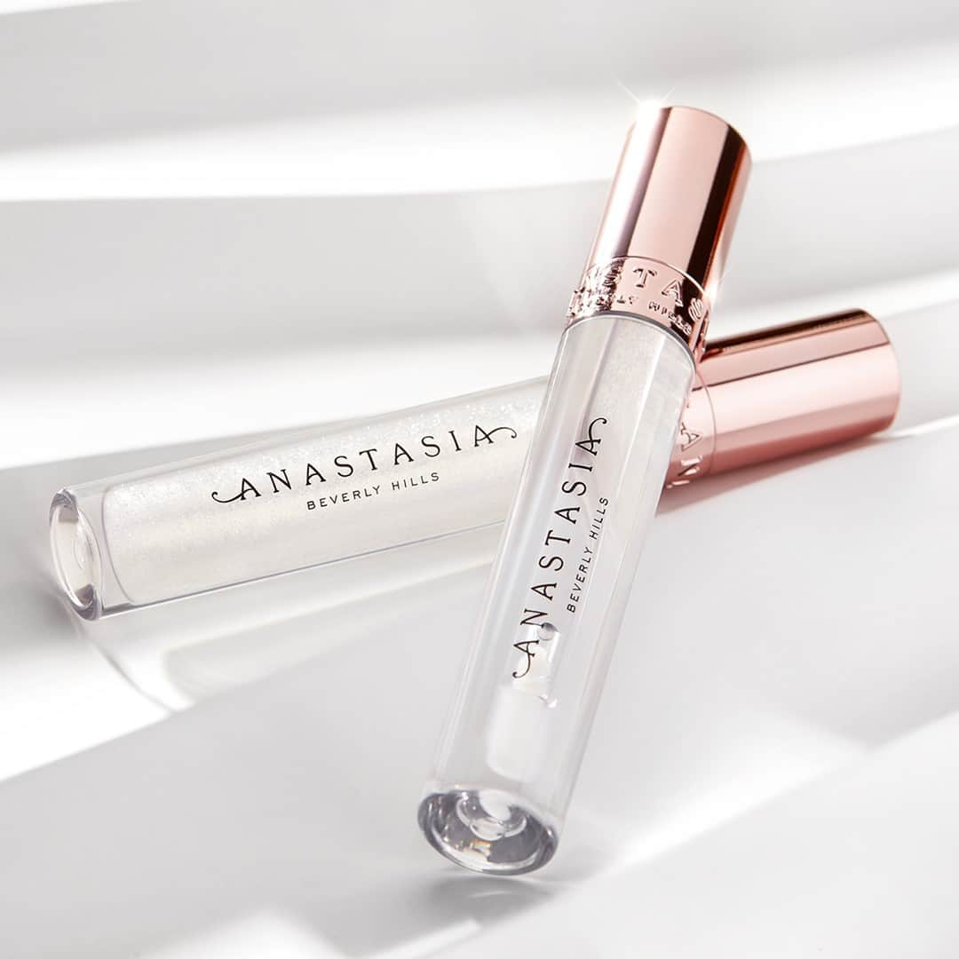 Anastasia Beverly Hillsさんのインスタグラム写真 - (Anastasia Beverly HillsInstagram)「We'd dare you to pick one, but why not both?! Our NEW Crystal Gloss in "Glass" 💫 and Diamond Gloss in "Honey Diamond" 💎 deliver glass-like shine with smooth, easy application. Crystal Gloss 💫 is crystal-clear with a fresh peach scent, while Diamond Gloss 💎 is packed with ultra-reflective golden sparkles and leaves a light vanilla scent.  💎 Wear over a bare lip 💎 Complements any skin tone 💎 Layer over a colorful lipstick to add shine or shimmer 💎 Luxe rose gold packaging earns a spot on your vanity  Shop our luxe new collection now via the link in our bio. 💫💎  #anastasiabeverlyhills #ABHIcedOut」1月14日 12時03分 - anastasiabeverlyhills