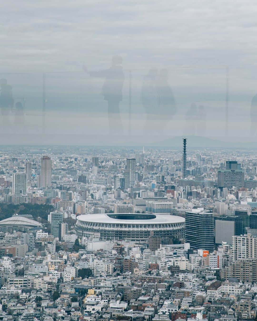 TIME Magazineさんのインスタグラム写真 - (TIME MagazineInstagram)「Japan has experience in using the Olympics as a catalyst for change. The Tokyo Games of 1964 served to salve wounds following World War II, rebranding this American foe turned ally as a high-tech playground. The Games were a coming out moment that helped define the city we know as Tokyo today. Japan hoped to repeat the trick this time around. But, even the best-laid plans were no match for 2020. In this photograph, a view of the new National Stadium from the observation floor of Shibuya Scramble Square in Tokyo in December 2019. Read more at the link in bio. Photograph by Kenji Chiga (@chigaa) for TIME」1月15日 5時12分 - time