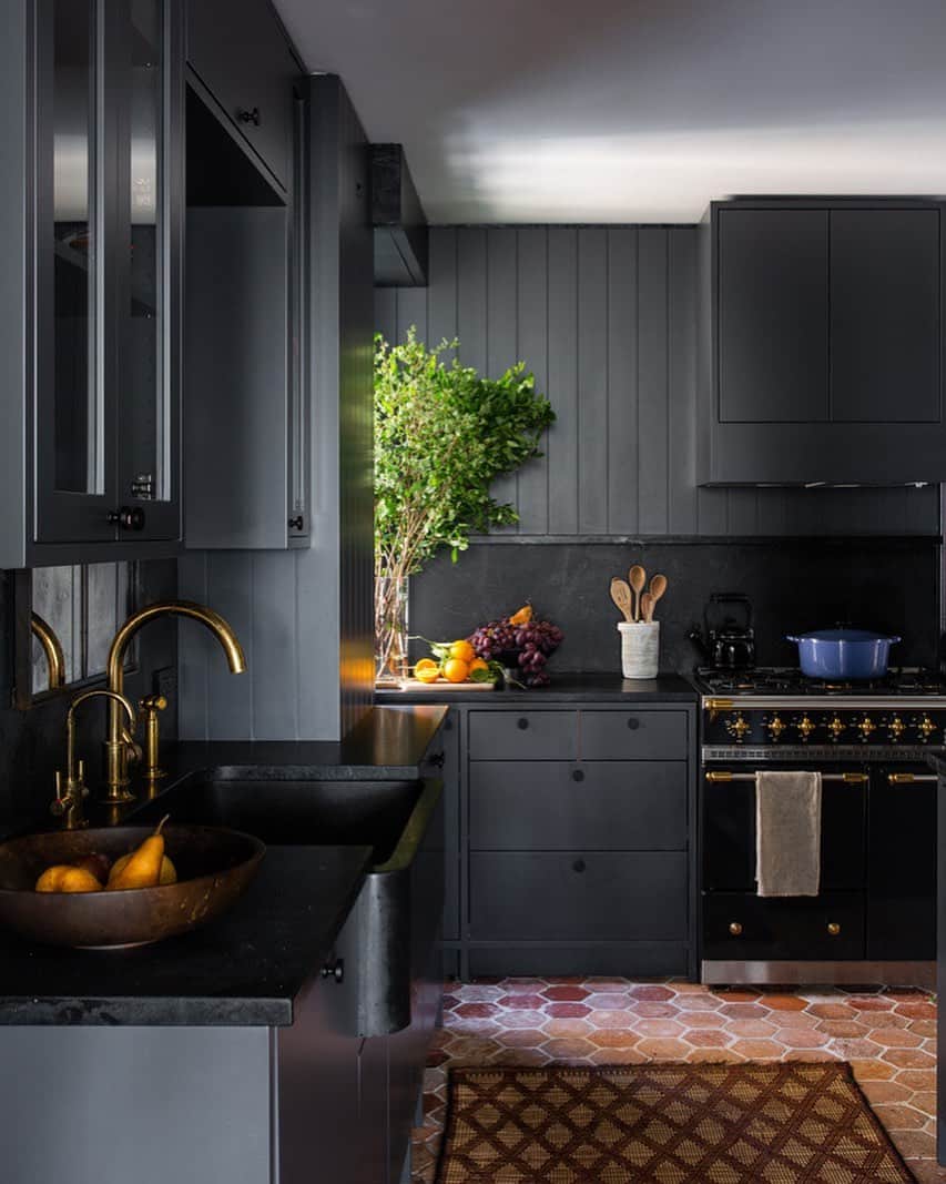 Homepolishのインスタグラム：「Add a twist and contrast to the traditional through cool finishes. The matte charcoal cabinetry acts as an elegant foil to the terracotta floors. Design by @ashe_leandro Photo by @shadedeggesphotography  Check out more pro tips from our designers at the link in bio.  Paint by @farrowandball」