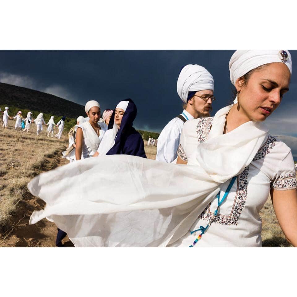 thephotosocietyさんのインスタグラム写真 - (thephotosocietyInstagram)「Photo by @andyrichterphoto//Following two and a half days of White Tantric Yoga, yogis in New Mexico take a blind walk through the arid landscape. With eyes closed, the group is led by a leader who calls out "Wahe Guru" while those following respond "Wahe Guru", an expression of ecstatic awe of the divine, sharing aloud the experience of going from darkness to light, from ignorance to true understanding. . From the series and monograph Serpent in the Wilderness. Follow me @andyrichterphoto for more photographs and stories on yoga and beyond. The feature “Finding Calm”, written by Fran Smith, was published in the January 2020 issue of the magazine and explores the myriad benefits of yoga. @thephotosociety @natgeo #yoga #asana #meditation #serpentinthewilderness #kehrerverlag #andyrichter #andyrichterphoto #kundaliniyoga #whitetantric #whitetantricyoga #newmexico #jemezmountains #espanola」1月16日 2時06分 - thephotosociety