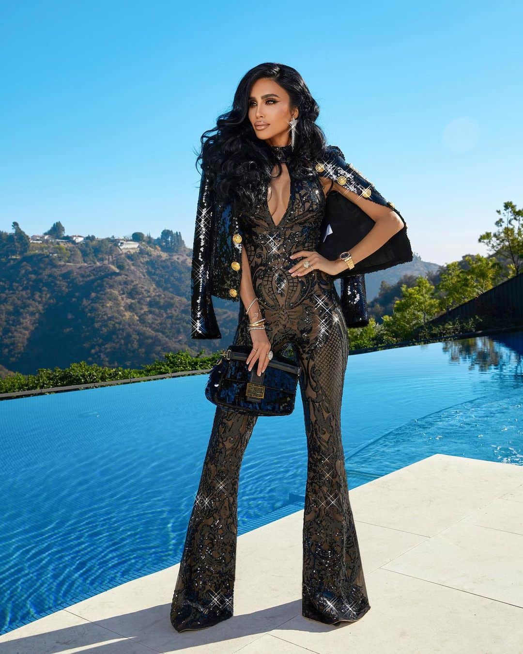 リリー・ガリーチのインスタグラム：「Comment the first word that came to your mind when you saw this outfit- good or bad 🙈 My favorite response will WIN this jumpsuit in their size!!  ▪️ Jumpsuit by @debbiecarrolldesigns - Jacket by Balmain - Purse By Fendi ▪️ Photos by @irmalomidze」
