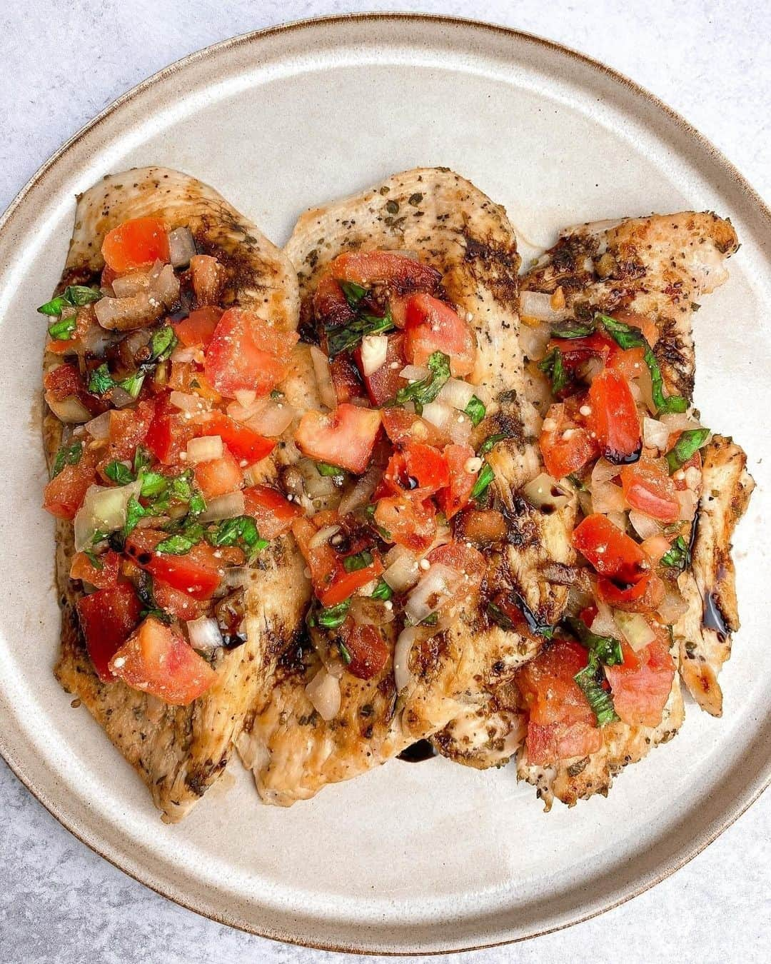 Flavorgod Seasoningsさんのインスタグラム写真 - (Flavorgod SeasoningsInstagram)「BRUSCHETTA CHICKEN 🤩 by @mandaameals seasoned with Flavorgod Italian Zest Seasoning!⁠ -⁠ Add delicious flavors to your meals!⬇️⁠ Click link in the bio -> @flavorgod  www.flavorgod.com⁠ -⁠  yummy Italian flavored grilled chicken topped with a fresh tomato, onion & basil mixture and drizzled with a delicious balsamic reduction! ⁣⁣⁣⁠ ⁣⁣⁣⁠ Ingredients: ⁣⁣⁠ • chicken breasts ⁣⁣⁠ • tomatoes 🍅 ⁣⁣⁠ • onions 🧅 ⁣⁣⁠ • basil 🌿 ⁣⁣⁠ • parmesan cheese ⁣⁣⁠ • balsamic vinegar ⁣⁣⁠ • @flavorgod italian seasoning ⁣⁣⁠ ⁣⁣⁠ Directions:⁣⁣⁠ • On a grill or @lodgecastiron grill pan, grill your seasoned chicken breasts until browned on both sides.⁣⁠ • In a separate bowl, add your diced tomatoes, onions, and chopped fresh basil. Season with salt, pepper and a little bit of olive oil. Add some balsamic vinegar and parmesan cheese & mix! Chill in fridge for 5-10 minutes. ⁣⁠ • Once chicken is done, set aside. For your balsamic reduction, add 1/2 cup of balsamic vinegar in a small saucepan. Bring to a boil. Then let it simmer for 10-15 minutes. It will start to reduce & thicken (remember that when it cools down, it thickens more). ⁣⁠ • Plate your chicken, add your mixture on top of the pieces & then drizzle the balsamic reduction on top. Done ✔️ ⁣⁠ ⁣⁠ You can pair this with any type of side! Super easy, fresh and delicious - I truly love the flavors of this dish.⁠ -⁠ Flavor God Seasonings are:⁠ 💥ZERO CALORIES PER SERVING⁠ 🔥0 SUGAR PER SERVING ⁠ 💥GLUTEN FREE⁠ 🔥KETO FRIENDLY⁠ 💥PALEO FRIENDLY⁠ -⁠ #food #foodie #flavorgod #seasonings #glutenfree #mealprep #seasonings #breakfast #lunch #dinner #yummy #delicious #foodporn」1月16日 9時01分 - flavorgod