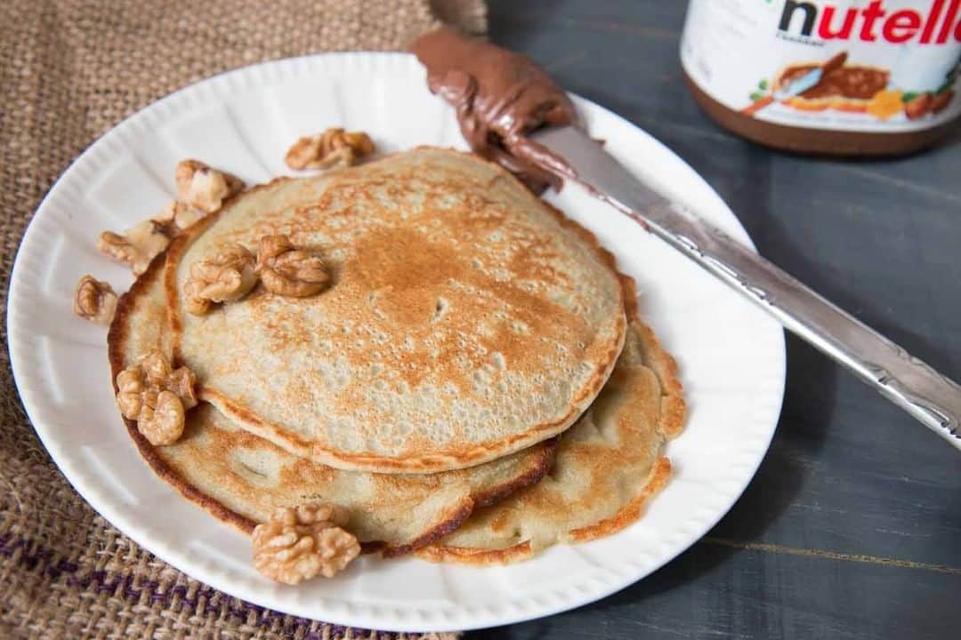 Archana's Kitchenさんのインスタグラム写真 - (Archana's KitchenInstagram)「The Pearl Millet Pancake With Walnuts & Nutella make a wholesome breakfast. It's packed with nutrition from the Bajra also known as the pearl millet. The goodness of whole wheat, coupled with bajra and eggs makes the pancakes filling and nutritious.  Serve the Pearl Millet Pancake With Walnuts & Nutella, bananas drizzled with honey or any other seasonal fruit of your choice. Get the recipe from the smart.bio link in my profile @archanaskitchen . . . . . . #recipes #easyrecipes #breakfast #Indianbreakfast #archanaskitchen #healthyeating #highprotein #breakfastclub #dosa #dosarecipes #dosabatter #ragi #ragidosa #mysoremasaladosa #homemadefood #eatfit #cooking #food #healthyrecipes #foodphotography #recipeoftheday #comfortfood #deliciousfood #delicious #instayum」1月16日 11時30分 - archanaskitchen