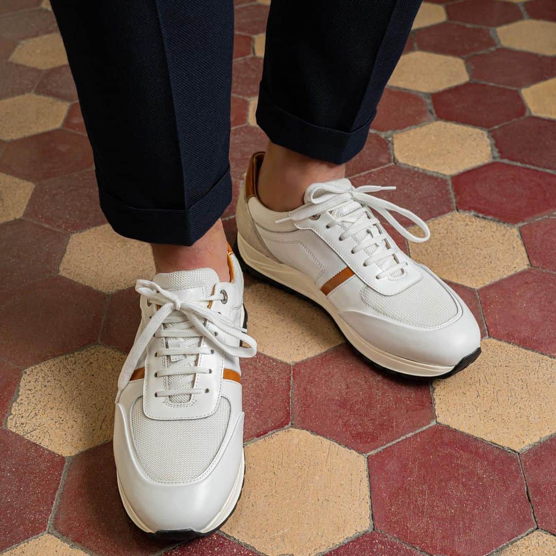 のインスタグラム：「The white color makes them easy to match, but A. Testoni’s heritage entrusts them to style.  #journeythroughtime #atestoni #fw20 #italiandesign #madeinbolognasince1929 #luxury #luxuryattire #italianheritage #finecraftsmanship #italianshoes #leathersneakers #menshoes #effortlesselegance」