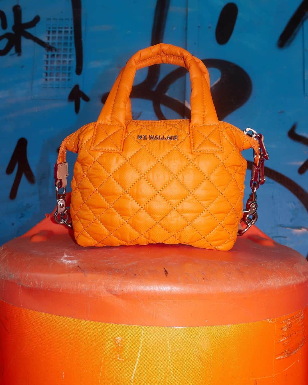 MZウォレスのインスタグラム：「In a sea full of monochrome colors, the hazard orange Micro Sutton is the color pop you need to brighten your day (and others!). Tap to shop.」