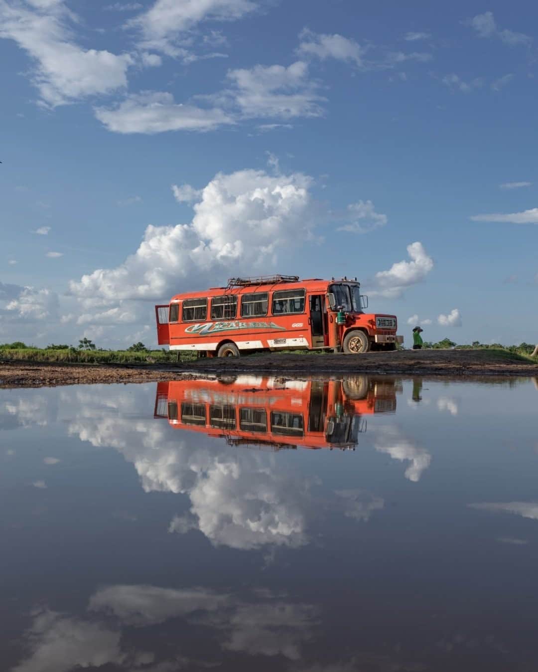 National Geographic Travelさんのインスタグラム写真 - (National Geographic TravelInstagram)「Photo by @juancristobalcobo / A bus waits for passengers beside flooded terrain by the Meta River at El Porvenir, a remote and tiny village in the region of Meta, Colombia. The country's broken geography makes access difficult to places outside of the big urban centers, and people resort to whatever means for transportation. #colombia #sky #juancristobalcobo」1月18日 16時39分 - natgeotravel