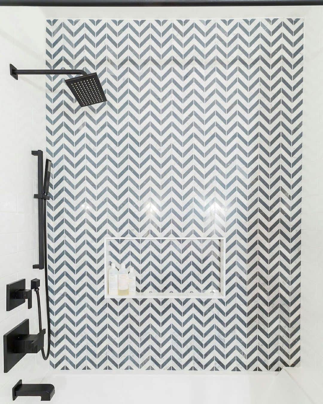 Sweeten Homeのインスタグラム：「How about a chevron shower tile for a strong design statement? This renovator found her inspiration by looking through Sweeten’s past projects. Where does your design inspiration come from?⁠⠀ ⁠⠀ Bathroom wall tiles: @classic.tile Shower fixture: @brizofaucet」