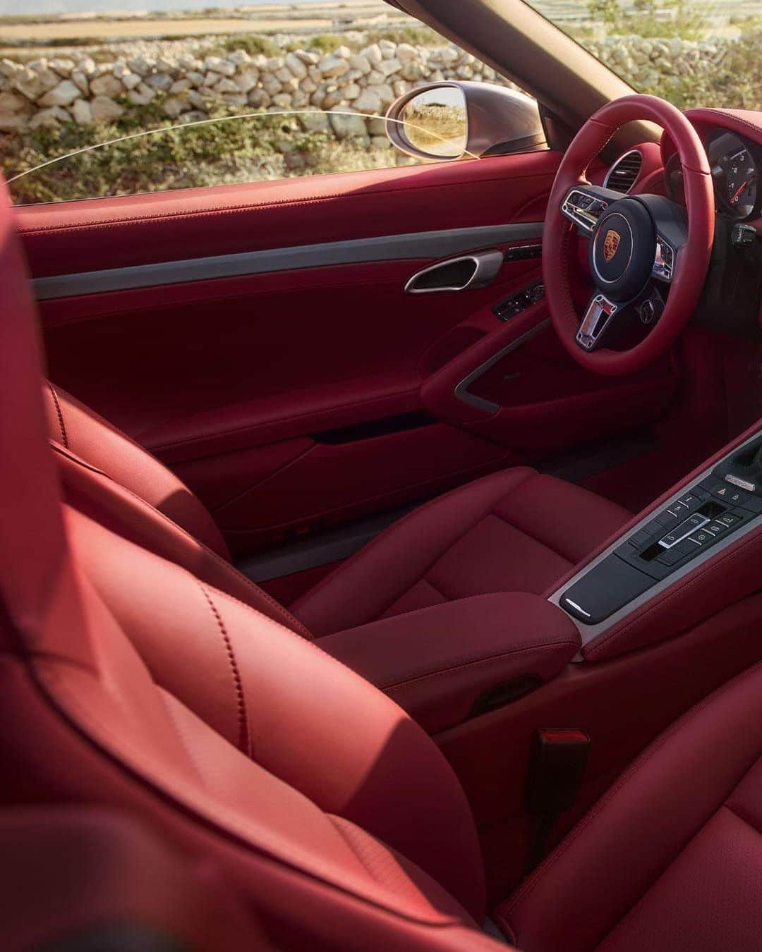 Porscheさんのインスタグラム写真 - (PorscheInstagram)「Striking red interiors coupled with silver exterior paintwork - an iconic colour palette that brings that roadster feeling to life, before you’ve even sat down. Go on, take a seat inside the Boxster 25 years.  Discover more: link in bio. __ Boxster 25 years: Fuel consumption combined: 10,9 - 10,1 km; CO2 emissions combined: 247 - 230 g/km  https://porsche.click/DAT-Leitfaden  Status: 01/2021」1月19日 19時58分 - porsche