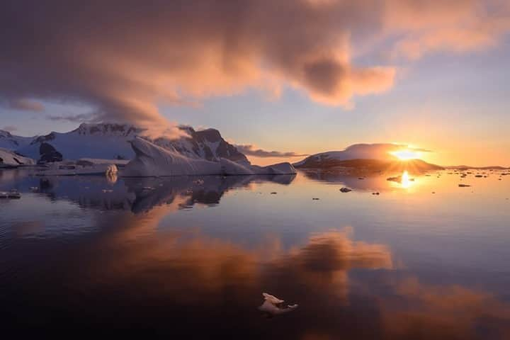 National Geographic Travelさんのインスタグラム写真 - (National Geographic TravelInstagram)「Photo by @daisygilardini / A gorgeous sunset along the Antarctic Peninsula. The warm colors of sunset usually put us in a reflective state of mind and naturally calm us down. In art and literature, sunsets often symbolize a quiet time to reflect, either on little things that happened during the day or the big questions in life. The end of the day causes most creatures to quietly tuck in for the night to rest and get ready for a new day and a new beginning. Follow me @daisygilardini for more images and behind-the-scenes stories. #sunset #antarctica #landscapephotography #climatechange #climatechangeisreal」1月20日 8時36分 - natgeotravel