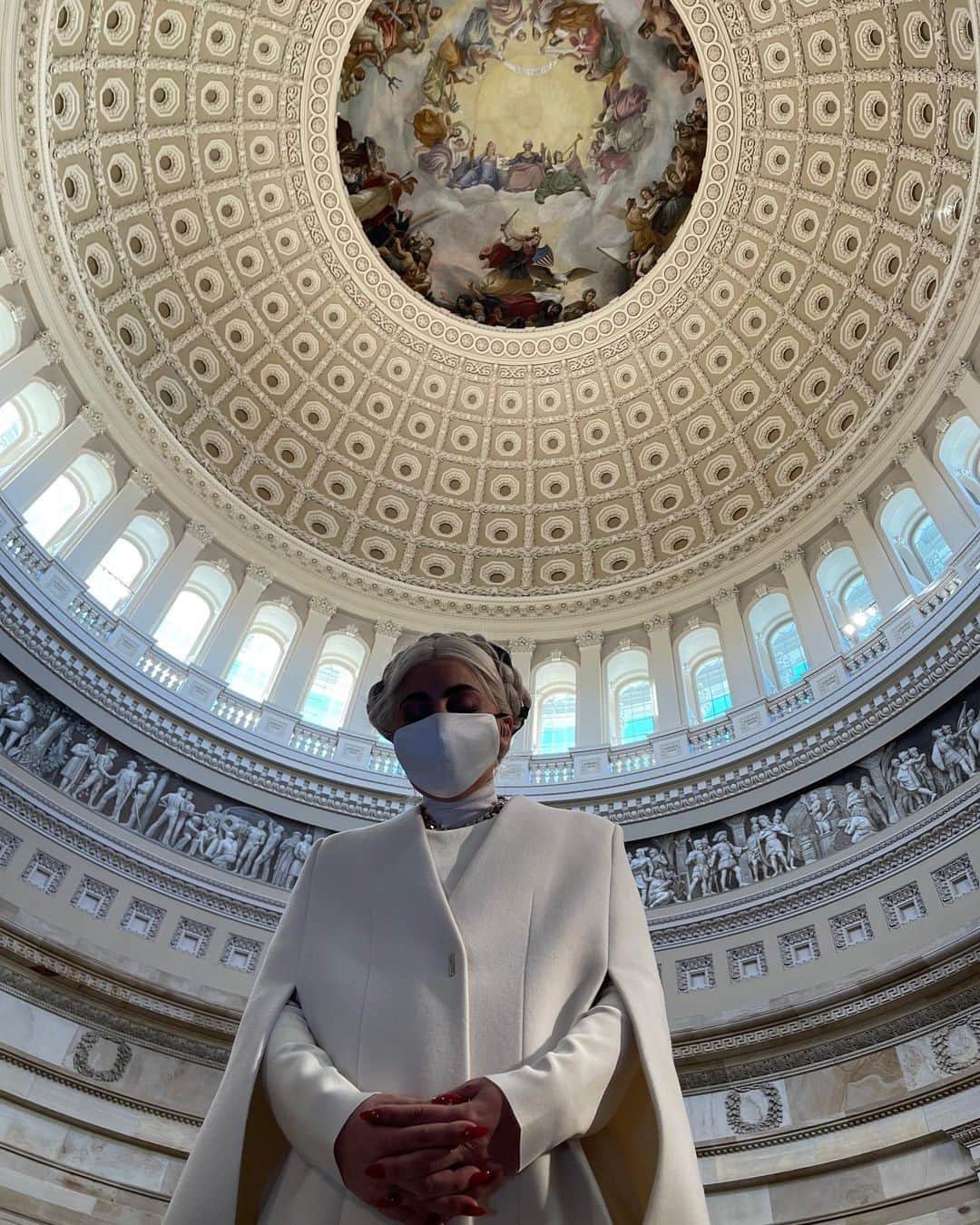 British Vogueさんのインスタグラム写真 - (British VogueInstagram)「After attending rehearsals for the performance of a lifetime at the inauguration of President-elect #JoeBiden and Vice President-elect #KamalaHarris, #LadyGaga paused to reflect in the Capitol. Wearing a custom @GivenchyOfficial coat in suffragette white, the pop powerhouse prayed for "A day for love, not hatred. A day for acceptance not fear." Click the link in bio for more on a look that nods to America's fresh start.」1月20日 21時05分 - britishvogue