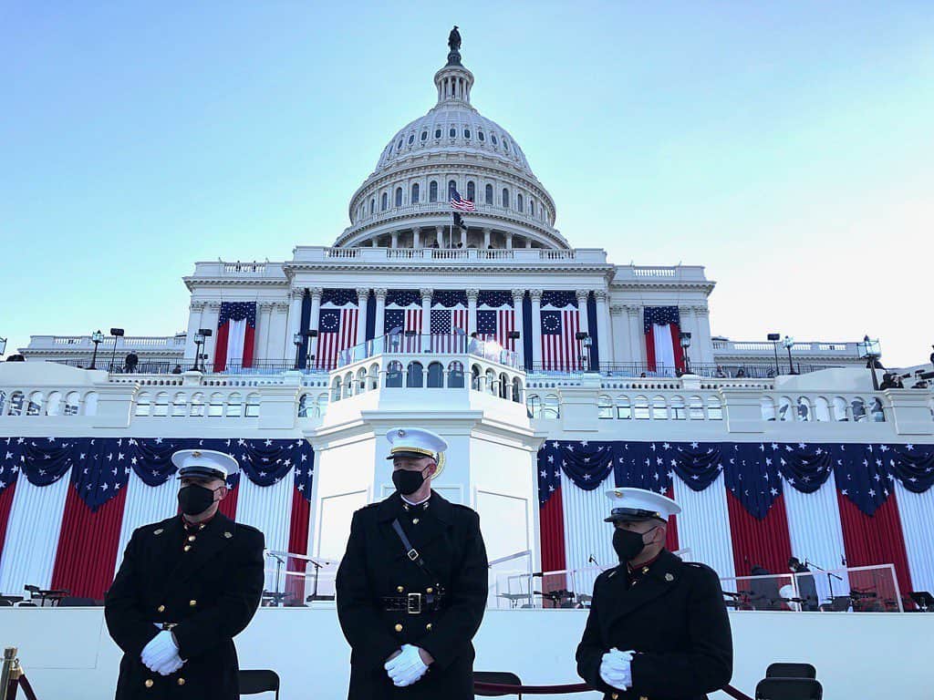 National Geographic Creativeのインスタグラム：「Photo by @louiepalu / Three Marines stand in front of the Inaugural grounds before Joseph Biden is sworn in as the 46th president of the United States.」