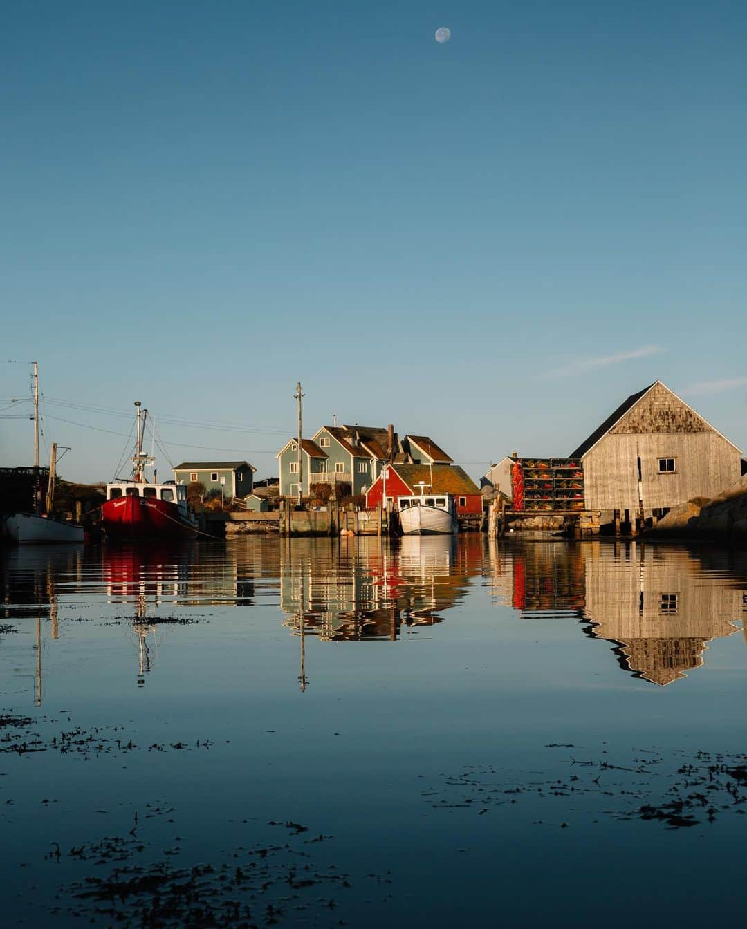 National Geographic Travelさんのインスタグラム写真 - (National Geographic TravelInstagram)「Photos by @MichaelGeorge / Peggy’s Cove at sunrise and sunset, with and without moon. Peggy’s Cove is not far from Halifax, a small fishing village that looks like a greeting card. There are lobster cages piled high near food trucks with lobster rolls. Not far from the lighthouse is a diner that opens early, welcoming visitors who have traveled to see the sights without the crowds. For more photos and writing from my travels, follow along @MichaelGeorge. #peggyscove #halifax #novascotia #fishingvillage #fishing」1月22日 0時38分 - natgeotravel