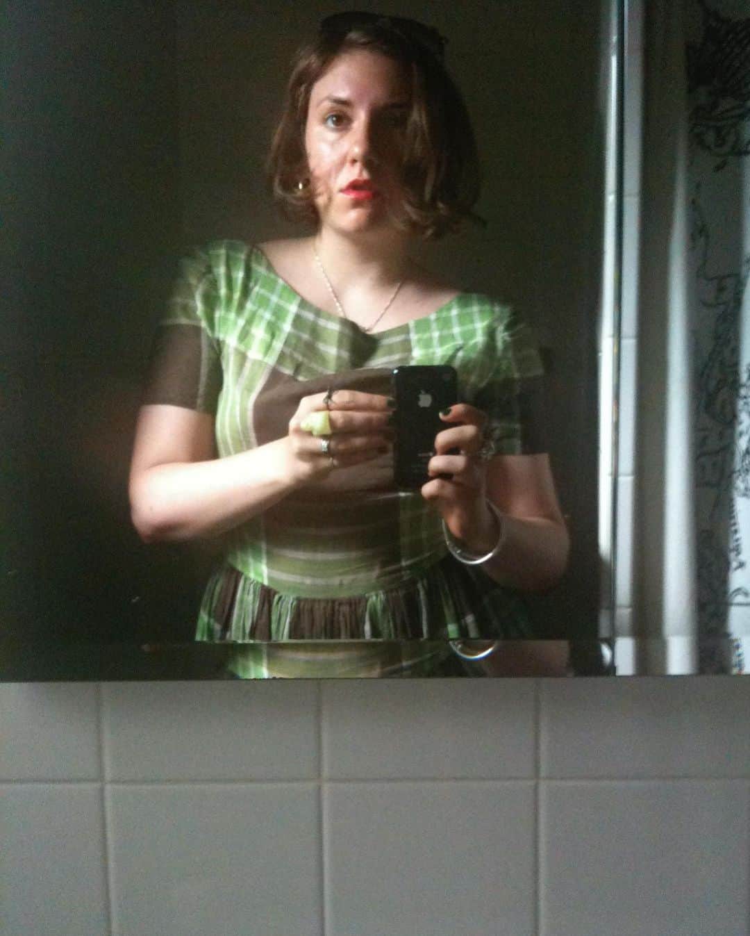 レナ・ダナムのインスタグラム：「Recently I came across this photo of me at 24. I could remember exactly where I was when it was taken- the bathroom of a bar in the dead heat of August, wearing a vintage dress of my mother's, with this overwhelming feeling (the kind you only get when you're young) that you’re on the precipice of some big change. It got me dreaming about what that girl would have thought if I could appear in that mirror and tell her what the next 10 years would hold. "Hello, it's me, 34 year old Lena. You're not gonna believe this but in, like, 2 months you're going to start on six seasons of a TV show. Are people gonna like it? That's a... complex question, but you will love making it, and you will learn exactly what your own voice sounds like. Oh, and you're going to write books. Like, WHOLE books. And yes, you will fully move out of your parents house and all the way to freakin' California- don't worry, I know it's Hollywood but you won't have to lose weight, in fact you'll gain it- and sometimes even to the UK. And yes, you have a million friends and collaborators you love and you aren't lonely in the ways you are now. Which is good because yeah, you know those random stomach aches? There's, like, a bunch of surgery coming. They're going to take out your uterus, which I know sounds kinda random but trust me, it's a bigger deal once you're older. And then you'll have to get sober. But you don't have a drug problem? Oh, please hold for that. And by the time you're my age you'll have kissed approximately 47 men (you still keep a list!) and literally none of them will be your husband. And you STILL can't fucking drive. But you know the weird part? It's all okay. It's better than okay. It's exactly what you were hoping for when you went into the bathroom and held this brand new thing called an iPhone up to the mirror thinking 'something great is coming.'"」