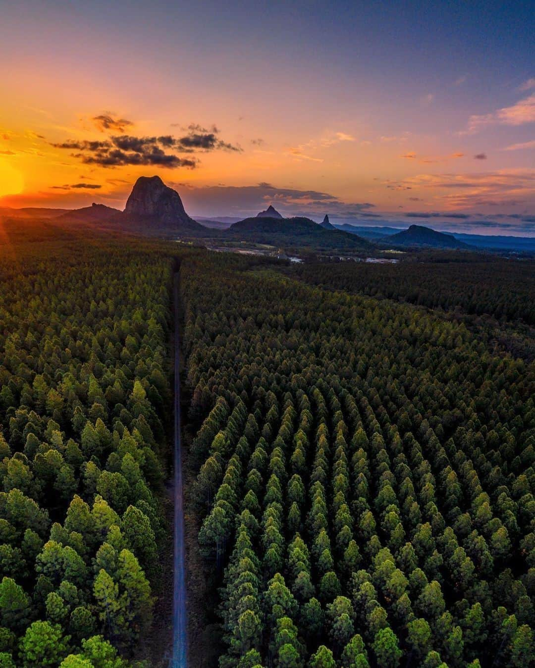 Australiaさんのインスタグラム写真 - (AustraliaInstagram)「Talk about the road to paradise! 🌲 🌄 @miss_sally_b got this amazing #drone shot where the mountains kiss the sky in the @sunshinecoasthinterland. This super scenic part of @queensland is just a short drive from the @visitsunshinecoast beaches and is home to the ancient volcanic peaks of the #GlassHouseMountains, lush rainforests, amazing food and wine, and luxury stays. Eat your way around the hinterland stopping at @Flamehillvineyard, @mapletontavern, and @kenilworthdairies, and wake up in luxury at @spicersretreats, @glassonglasshouse, or @aquilaretreat. #seeaustralia #holidayherethisyear #thisisqueensland #visitsunshinecoast #sunshinecoasthinterland」1月22日 4時00分 - australia