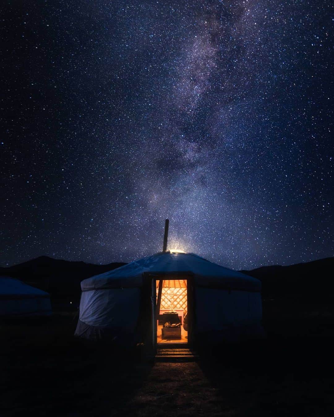 Canon Asiaのインスタグラム：「As @nelsonandhisplanet puts it, "In the cities, to be alone is to get inside of your apartment, but here (in Mongolia) is to go outside." . It is always compelling to see the difference between urban cities 🌆with their high-rise buildings and bustling streets against the quiet sceneries of grasslands and an unobstructed view of the night sky 🌌 . 📷 Image by @nelsonandhisplanet using the Canon EOS R • EF16-35mm F/2.8L USM • 16mm  Foreground captured at 1/40s • f/2.8 • ISO 3200 Milky Way captured at 30s • f/2.8 • ISO 4000 . Got a stunning shot you're proud of? Tag them with #canonasia or submit them on My Canon Story, link in bio! . #canonasia #photography #explore #nightscape #night #nightsky #landscape #nightphotography #stars #composition #canon #lens #inspiration #subject #light」