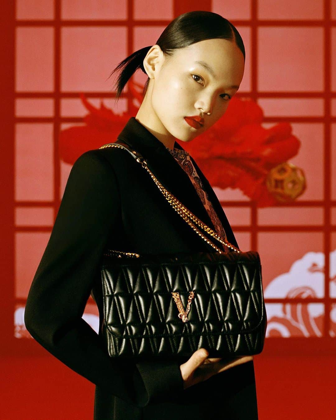 ジャンニヴェルサーチのインスタグラム：「Designs to treasure - Pan Haowen is photographed wearing pieces from our limited edition Lunar New Year capsule collection. Learn more through the link in bio.」