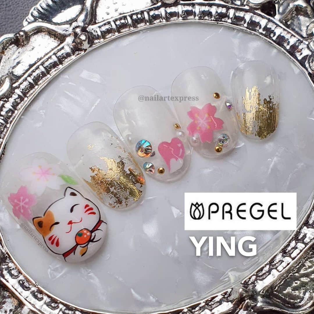 Yingのインスタグラム：「Swipe left to see inspo from a cny red packet design!  I used PREGEL White, PREGEL MUSE M072, PREGEL Art Liner in Red, Black, White, Green and Orange. Paired with @tsumekira @yuminailjp YUMI LING Dancing of Spring Cherry Blossom NN-YML-101. Items can be purchased at @nailwonderlandsg 🤗 .   . 🛒 www.nailwonderland.com⁣⁣ 📍20A Penhas Road, Singapore 208184⁣⁣ (5 minutes walk from Lavender MRT)⁣⁣ .  I am currently only able to take bookings from my existing pool of customers. If I have slots available for new customers, I will post them on my IG stories. Thank you to everyone who likes my work 🙏 if you need your nails done, please consider booking other artists at @thenailartelier instead ❤  #ネイルデザイン  #ネイルアート #ネイル #ジェルネイル #nailart #네일아트 #pregel #プリジェル #nails #gelnails #sgnails」