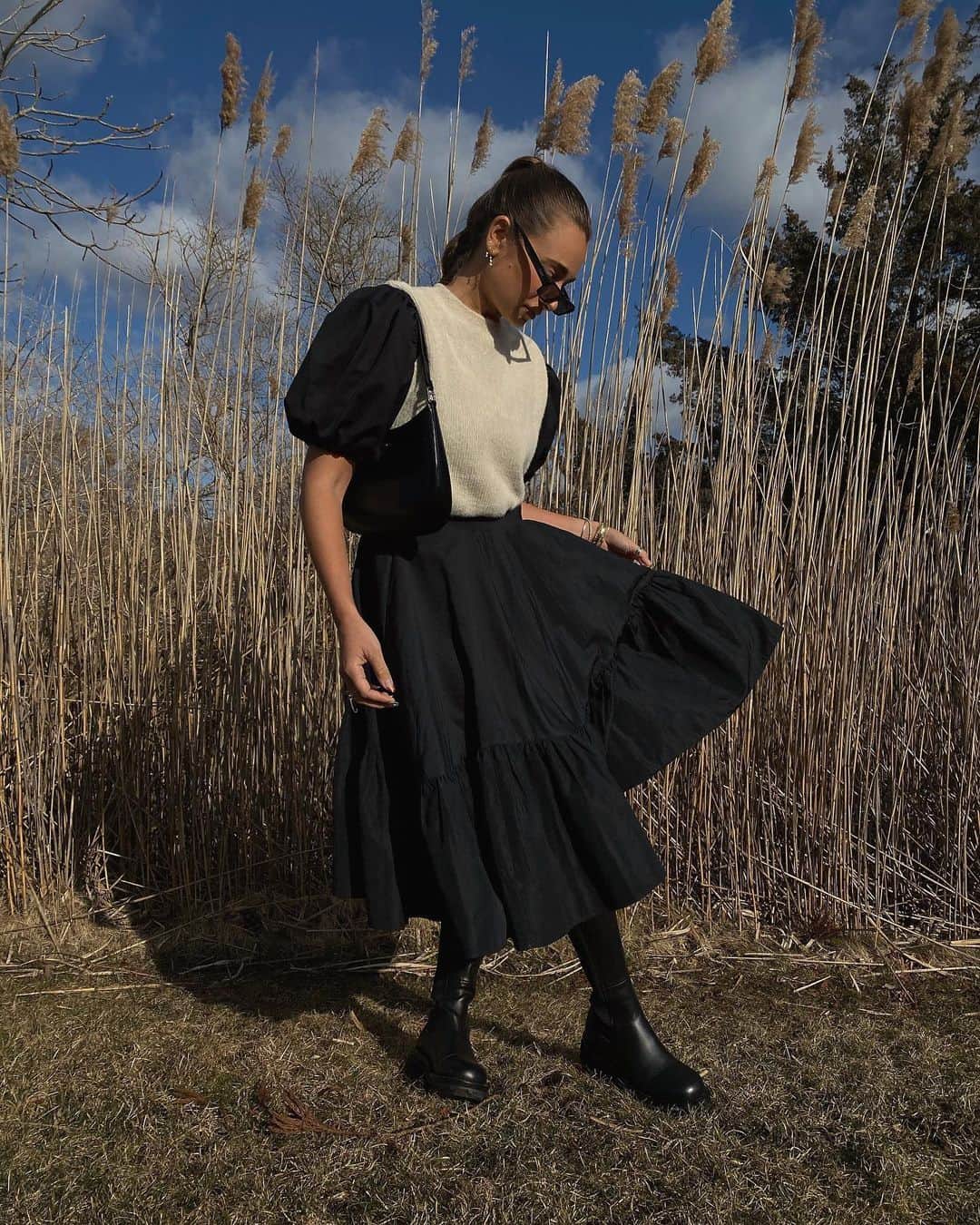 We Wore Whatのインスタグラム：「Note to self: if you want to take an outfit photo when it’s freezing, work out right before. Found this vintage skirt at a little shop in Kingston last weekend, it immediately made me think of @ceciliebahnsen one if my favorite designers, and was totally inspired by her when styling this too. Wearing an old @georgiaaliceofficial puffy sleeve top with a Zara sweater vest layered! Chunky boots and that’s my ramble for the day 👍🏻」