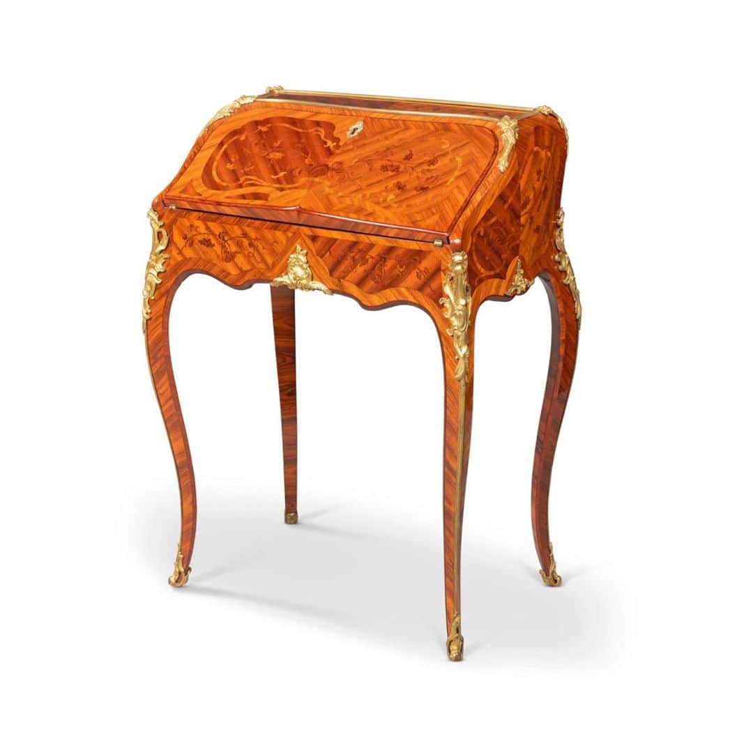 クリスティーズのインスタグラム：「This elegant bureau de dame, with jewel-like chased mounts framing panels inlaid in bois-de-bout floral parquetry, is a masterpiece of the celebrated cabinet maker Roger van der Cruse, dit Lacroix.⠀ .⠀ It was commissioned in the early years of his career circa 1755 for one of his most important royal patrons: Madame Louise-Elisabeth (1727-1759), dite Madame Infante, Duchess of Parma and daughter of Louis XV, for one of her palaces in the Duchy of Parma.⠀ .⠀ A Royal Louis XV Ormolu-Mounted Tulipwood, Kingwood and Bois-De-Bout Marquetry Bureau En Pente, by Roger Van Der Cruse ('RVLC'), Dit Lacroix, c.1755. Price on request.⠀ . 📍Available via Christie's Private Sales. Follow the link in bio ⬆️ for our Private Sales Viewing Rooms.⠀ .⠀ @amjadrauf1  #RogervanderCruse #bureau #marquetrybureau #privatesales #christiesprivatesales #tulipwood #kingwood」