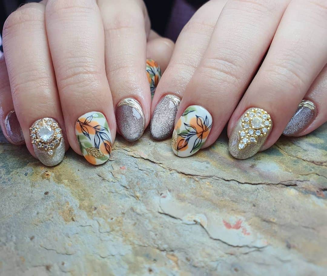 Yingのインスタグラム：「Swipe left for the inspo (a notebook from Typo!)  I used PREGEL MUSE S338, PREGEL Pastel Ivory, Orange (mixed with #871), #823, PREGEL Art Liner in Black, and PREMDOLL Sugar Platinum. Also used @tsumekira Gold Leaf Parts sticker SG-Lep-101. There is crystal cat eye effect in this set too! Items can be purchased at @nailwonderlandsg 🤗 . Design adapted from @itohanako  . 🛒 www.nailwonderland.com⁣⁣ 📍20A Penhas Road, Singapore 208184⁣⁣ (5 minutes walk from Lavender MRT)⁣⁣ .  I am currently only able to take bookings from my existing pool of customers. If I have slots available for new customers, I will post them on my IG stories. Thank you to everyone who likes my work 🙏 if you need your nails done, please consider booking other artists at @thenailartelier instead ❤  #ネイルデザイン  #ネイルアート #ネイル #ジェルネイル #nailart #네일아트 #pregel #プリジェル #nails #gelnails #sgnails」