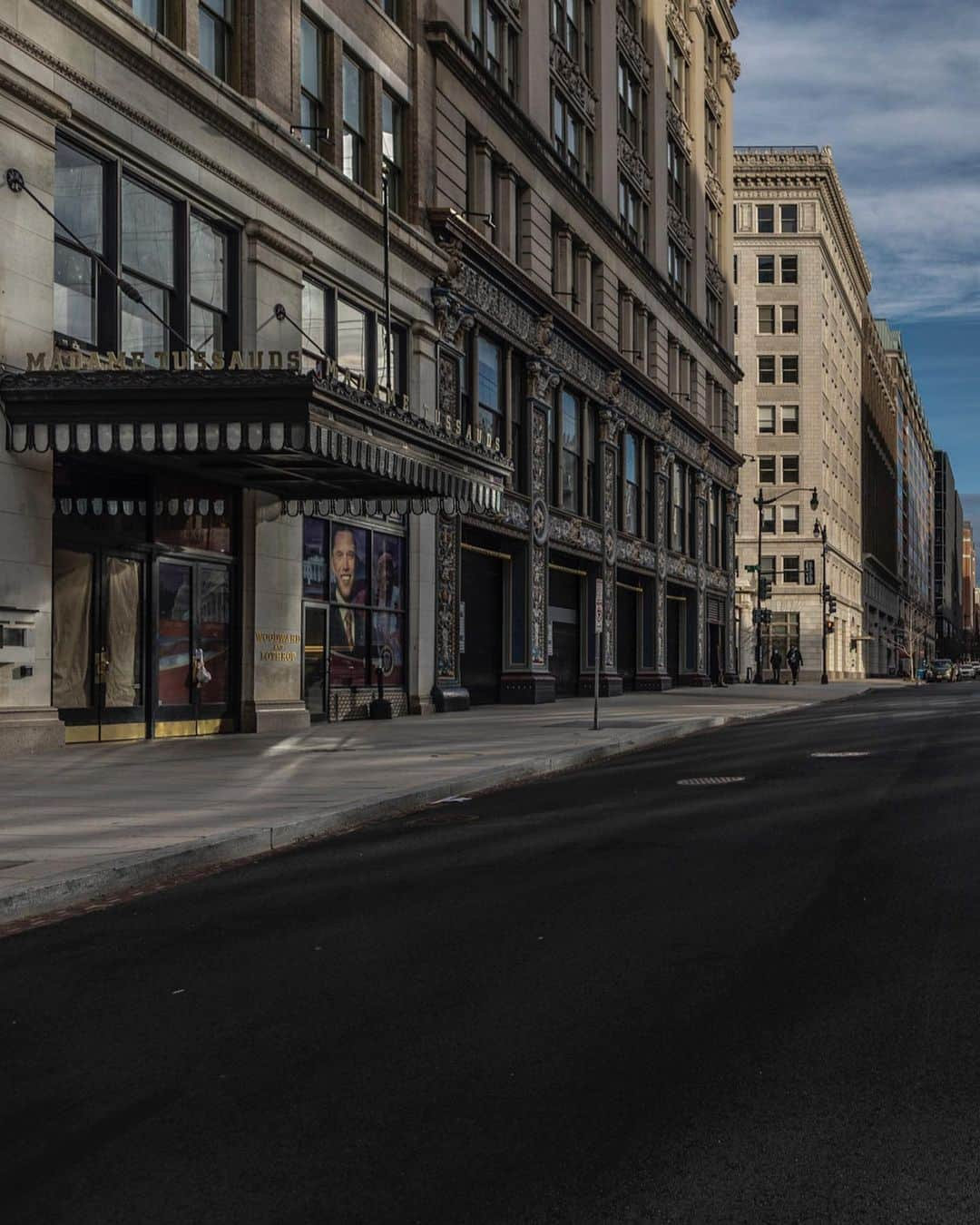 ジョン・スタンメイヤーさんのインスタグラム写真 - (ジョン・スタンメイヤーInstagram)「Last week, some of you kindly joined me on a bicycle ride with Jezebel through the deserted streets of Washington, DC. It was four days before the inauguration of President @potus Joe Biden and @vp Kamala Harris. We were together during an “Ask Me Anything” while on the never-ending we do… trying to feel something, anything of meaning, for a @natgeo story on the Ghostlands of DC. When responding to a question about why I am bored by the photography I’m seeing bring created, even the photography I make, we turned onto 10th Street NW. Out of nowhere, a spaceship appeared... a glowing square floating in emptiness. The sunlight reflected across potholes, tire marks, the lamps by a church ignited by the sun in a movie set with no actors. We stopped, parked in the middle of what usually would be a traffic-filled street. Mounted to Jezebel, the IG Live kept running while this gift of simplicity was given to us, in the expecting nothing, thankful for anything. A lone white car was in the distance and on the left another gift in the window of Madame Tussauds’ Wax Museum; A large photograph of the former president, @barackobama, tying in the narrative of presidents during last weeks most unusual inauguration in this countries existence. Quiet little tiny pieces within the vastness of abandonment. The photography from 10th Street is on the six video files. As we rode together, until Jezebel, in all my clumsiness, toppled over, spilling a precious cup of coffee. Enjoy the strangeness… ⠀⠀⠀⠀⠀⠀⠀⠀ @natgeo #askmeanything #ghostlandsofDC #abandonment #barackobama #MadameTussauds #sunlight #shinnybuilding #chuch #spaceship」1月25日 13時09分 - johnstanmeyer