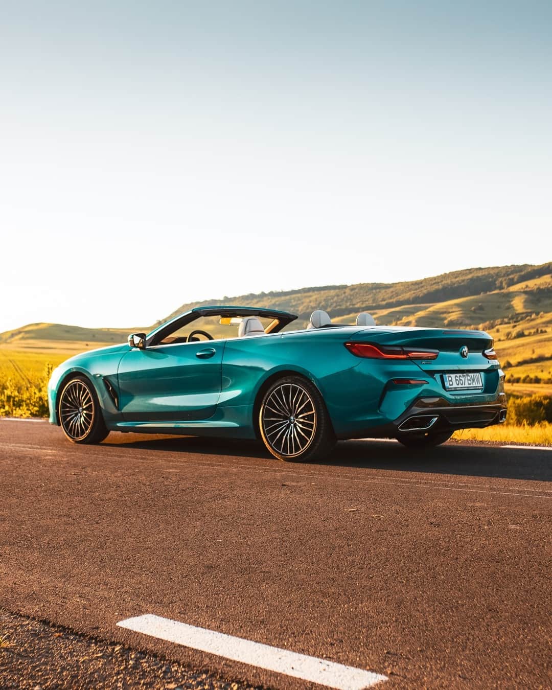 BMWのインスタグラム：「Here comes the sun.  The BMW 8 Series Convertible. #THE8 #BMW #8Series #BMWrepost @ciprianmihai __ BMW M850i xDrive Convertible: Fuel consumption weighted combined in l/100km: 10.1–10.0 (NEDC); 10.9–10.8 (WLTP), CO2 emissions weighted combined in g/km: 229–132 (NEDC); 248–246 (WLTP). Further information: www.bmw.com/disclaimer」