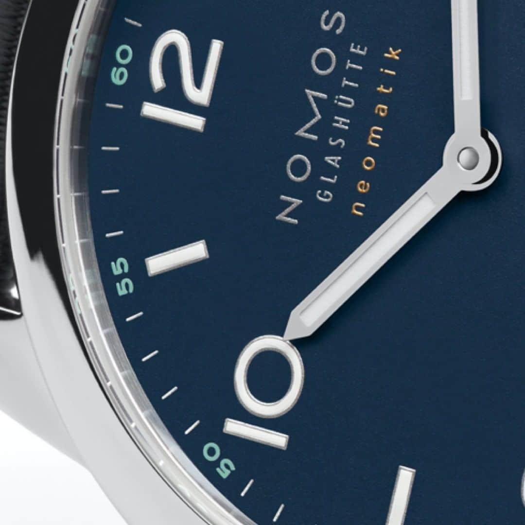 のインスタグラム：「This Macro Monday comes with an elegant splash of deep blue: Can you tell which NOMOS watch this is?  #nomos #nomosglashuette #MacroMonday」