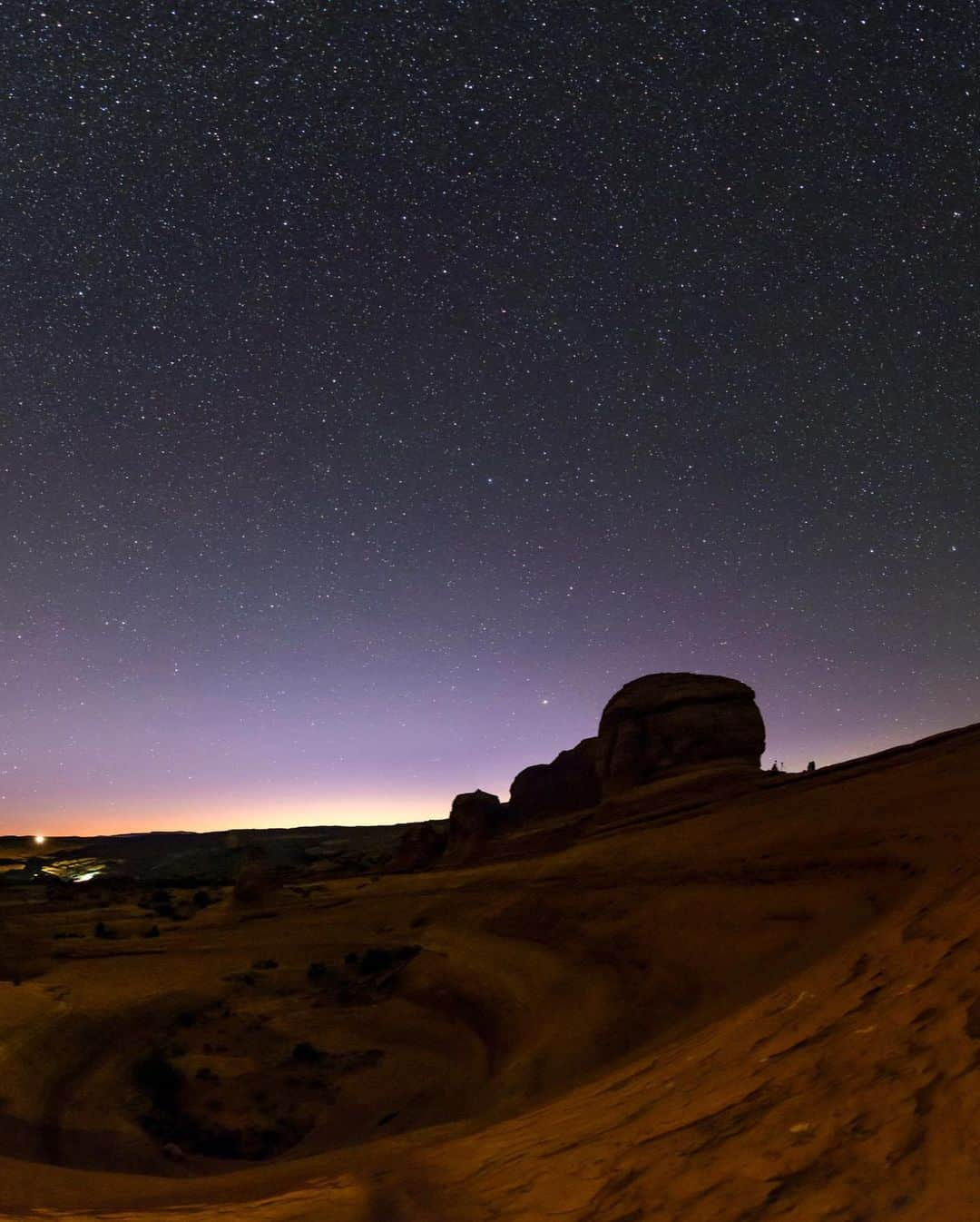 National Geographic Travelさんのインスタグラム写真 - (National Geographic TravelInstagram)「Photo by @babaktafreshi / Swipe to see the entire view of Delicate Arch at night. The Milky Way appears above the desert landscape of Arches National Park as the last glow of evening twilight fades to darkness. The 52-foot-tall (16-meter-tall), freestanding natural arch, illuminated by a portable light in this exposure, is an iconic view of the American Southwest. This makes it a very popular spot both day and night, despite the steep uphill hike.  Explore more of the world at night photography @babaktafreshi. #utah #nightsky #twanight」1月26日 0時48分 - natgeotravel