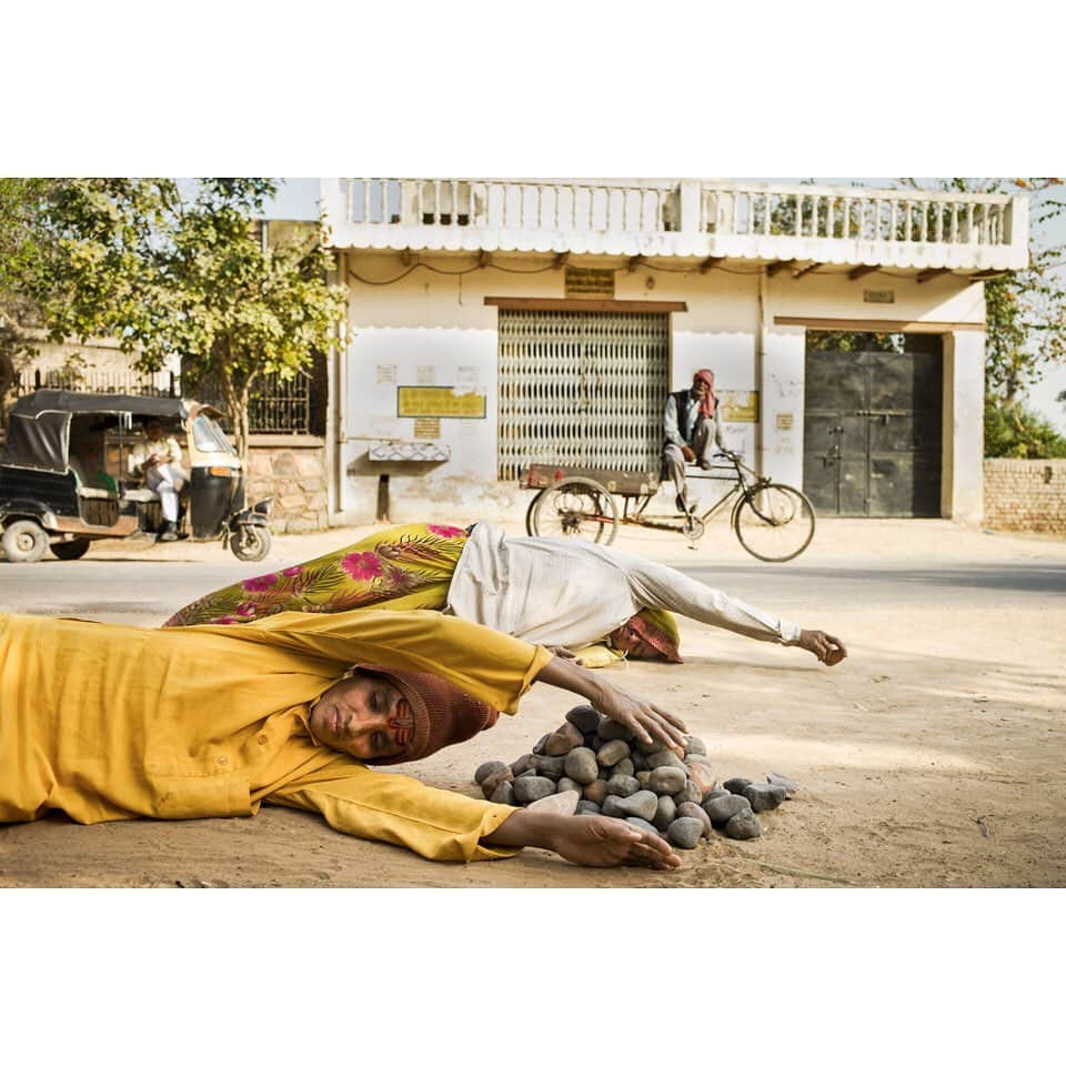 thephotosocietyさんのインスタグラム写真 - (thephotosocietyInstagram)「Photo by @andyrichterphoto / Krishna devotees prostrate during their circumambulation of Govardhan Hill, near Govardhan, India. Moving one stone her body’s length with each prostration (of 108 stones), the devotee in the foreground's parikrama, or walk around the sacred hill, will require 12 years to complete. Her bhakti, or devotion to Krishna, keeps her moving forward. . From the series and monograph Serpent in the Wilderness. Follow me @andyrichterphoto for more photographs and stories on yoga and beyond. The feature “Finding Calm”, written by Fran Smith, was published in the January 2020 issue of the magazine and explores the myriad benefits of yoga. @thephotosociety @natgeo #yoga #asana #meditation #serpentinthewilderness #kehrerverlag #andyrichter #andyrichterphoto #harekrishna #govardhan #india #parakrama #bhaktiyoga」1月26日 2時24分 - thephotosociety