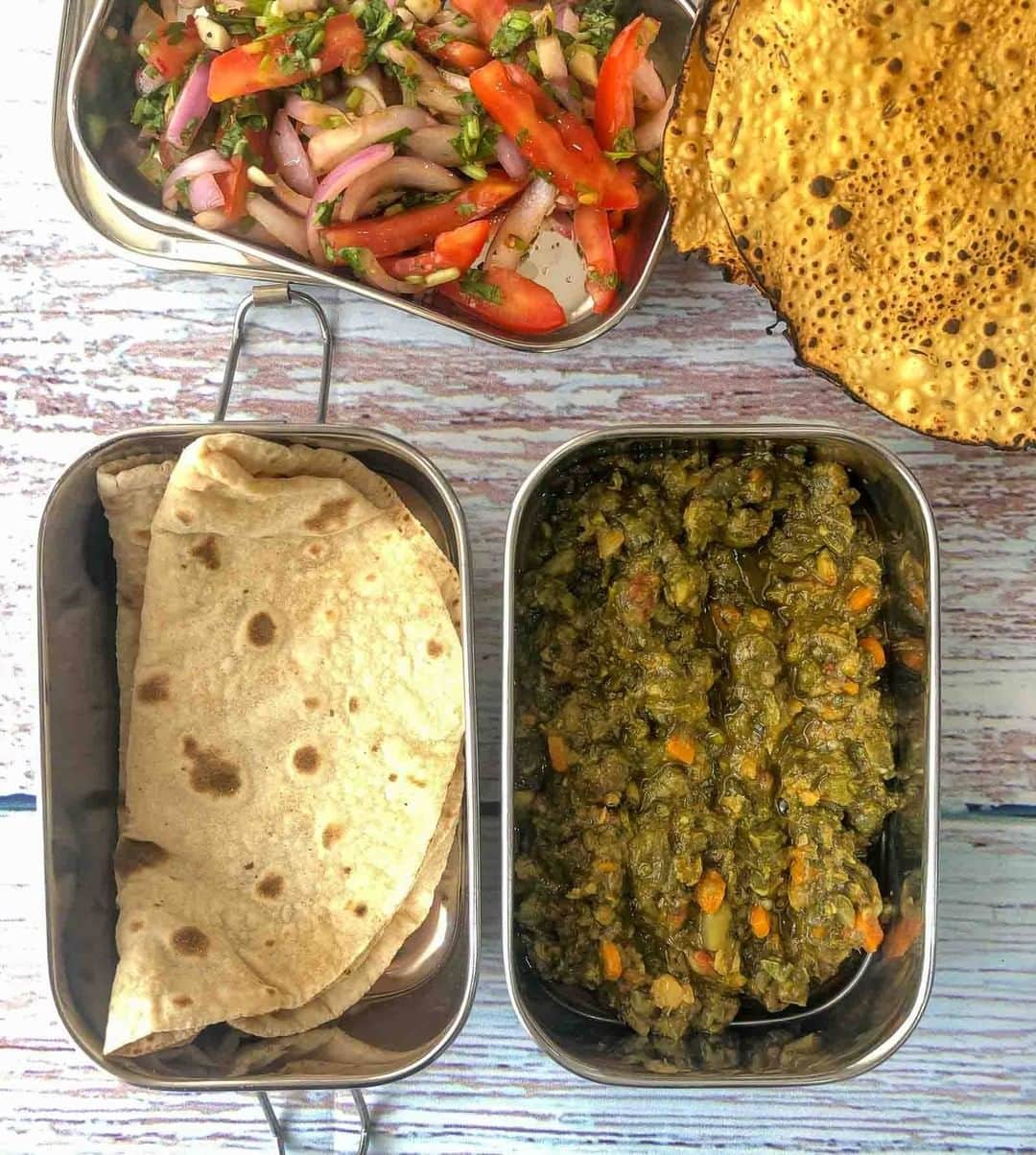Archana's Kitchenさんのインスタグラム写真 - (Archana's KitchenInstagram)「#lunchboxideas  Here is a simple yet delicious lunch box recipe with Sindhi Sai Bhaji, Phulka, Salad & Papad. Adding soothing, cooling elements like a salad, and adding crunchy roasted papad makes the lunch box complete and satisfying. Get the recipe from the smart.bio link in my profile @archanaskitchen . . . . . . #recipes #easyrecipes #indianlunch #lunchbox #archanaskitchen #healthyeating #highprotein #breakfastclub #dosa #dosarecipes #dosabatter #ragi #ragidosa #mysoremasaladosa #homemadefood #eatfit #cooking #food #healthyrecipes #foodphotography #recipeoftheday #comfortfood #deliciousfood #delicious #instayum」1月26日 14時30分 - archanaskitchen