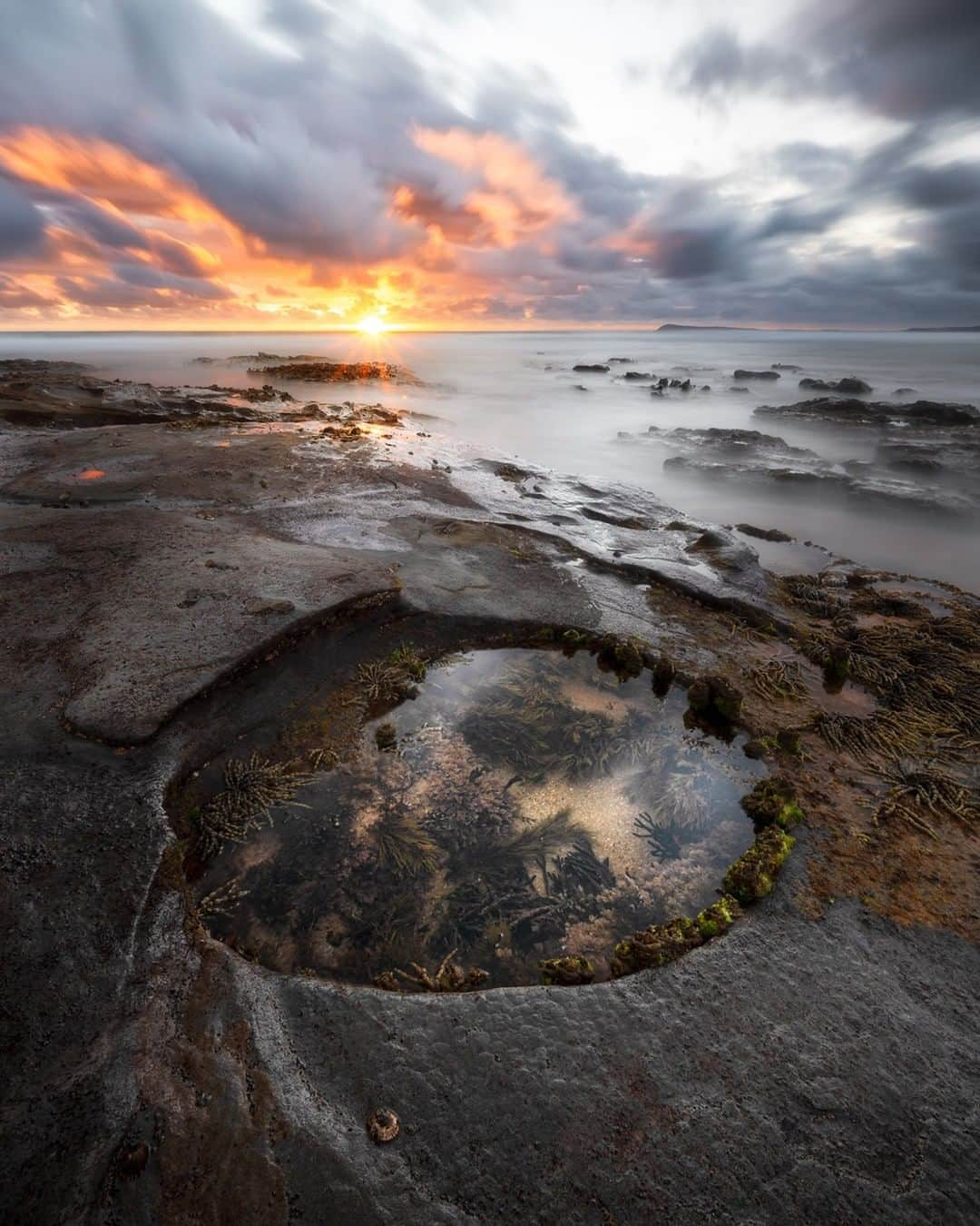 Nikon Australiaさんのインスタグラム写真 - (Nikon AustraliaInstagram)「"This shot was taken along the Kilcunda coastline. We searched for a few different rock pools that would work for the shot. We found this one that was circular and was next to an inlet.   I took a few shots with various exposures using a circular filter. I found the longest exposure of 30 seconds worked best and gave a decent mood." - @patricksflicks   Camera: Nikon Z 6 Lens: NIKKOR Z 14-30mm f/4 S Settings: f/22  30s  ISO 100  #Nikon #MyNikonLife #NikonAustralia #NikonZ6 #Z6 #ZSeriesAU #LandscapePhotography #Seascape #RockPool #LandscapeLover #LongExposure」1月27日 13時00分 - nikonaustralia