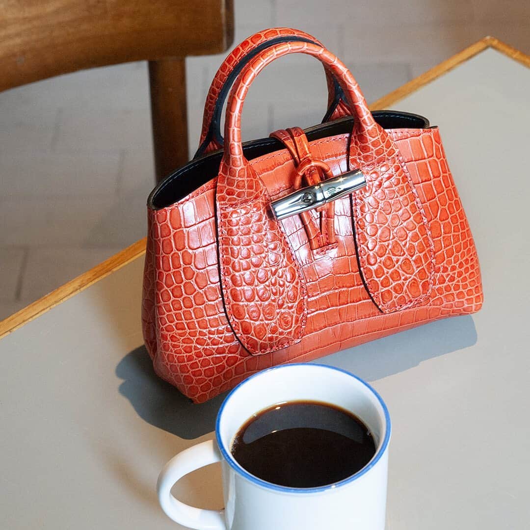Longchampのインスタグラム：「"She didn't need much... just a hot café, and a little fashion, and life was wonderful." #TresParis  #LongchampTresParis #LongchampRoseau #Longchamp」