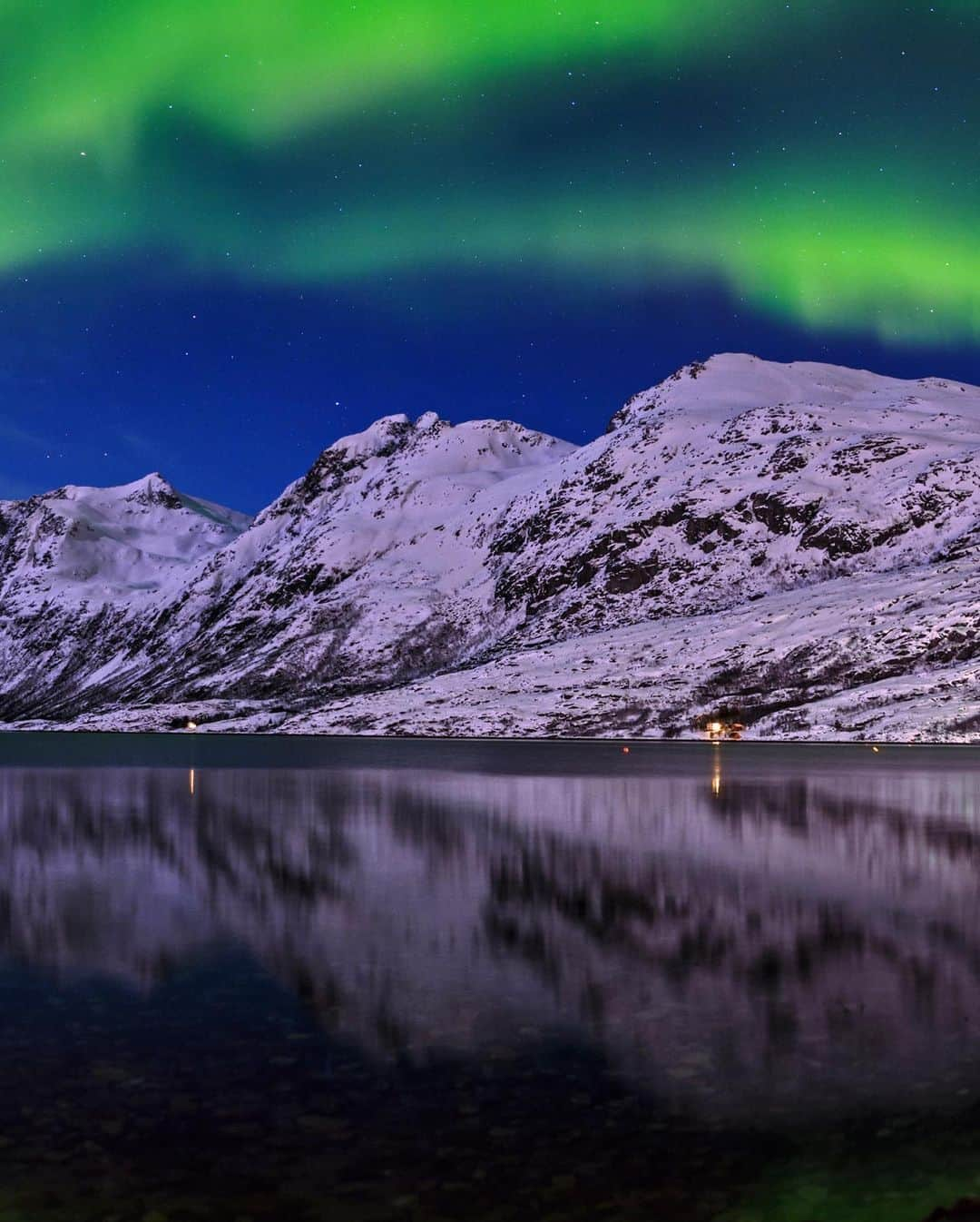 National Geographic Travelさんのインスタグラム写真 - (National Geographic TravelInstagram)「Photo by @babaktafreshi / The northern lights reflect on a fjord in this five-second photograph under moonlight. Swipe to see the entire view of this magnificent aurora display in Norway. On this March 2013 night, the aurora was completely absent in the evening, but near midnight this large swirl suddenly formed from nowhere.  Explore more of the world at night photography @babaktafreshi. #aurora #northernlights #norway #twanight」1月28日 4時37分 - natgeotravel