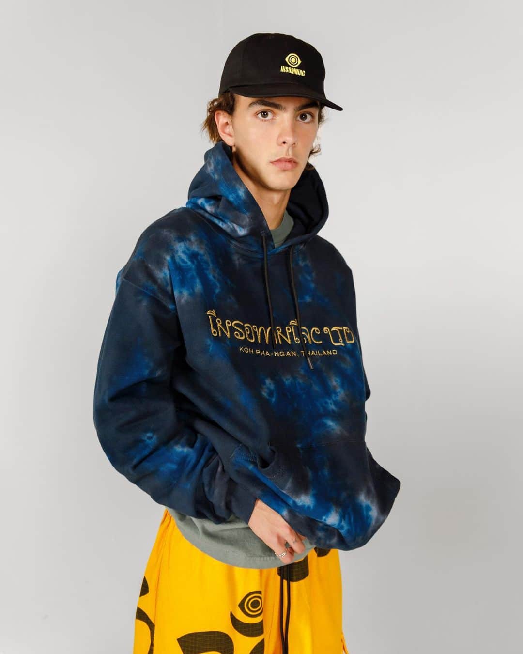 サキャスティックのインスタグラム：「@insomniacltd WINTER   Koh Phanghan Hoody Blue 14oz heavyweight cotton fleece, pre-shrunk, custom drawcords, direct embroidery. Made in the USA.  Ohm Eye Cargo Pant Gold Allover silkscreen & overdyed cotton ripstop, cargo pockets, custom drawcords. Made in USA.  Dugout Hat Black 7.5oz poly cotton twill 6 panel snapback, direct embroidery. Made in USA.」